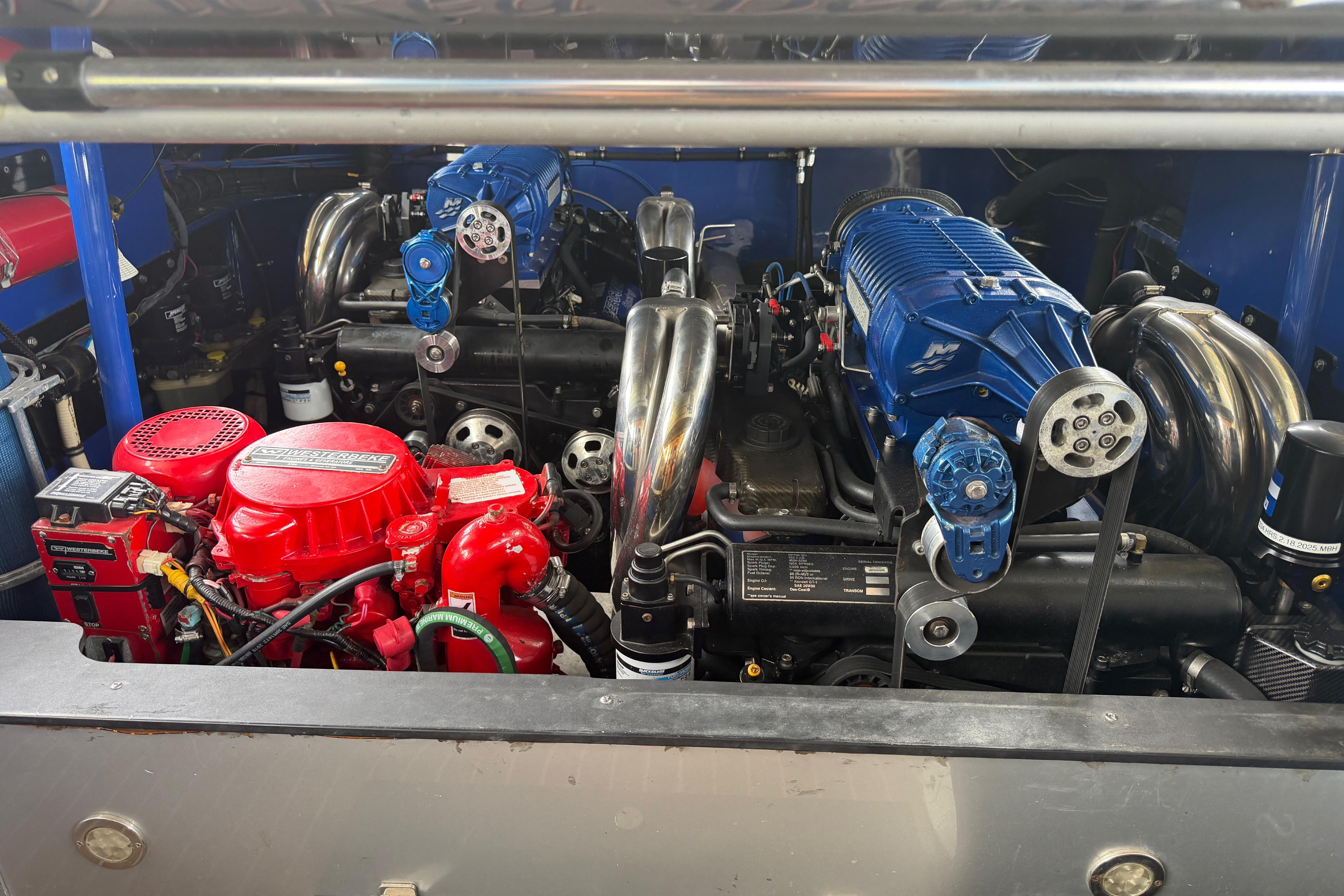 Engine compartment of a 2013 Nor-Tech 477 SPX Vee Bottom boat, showcasing powerful components.
