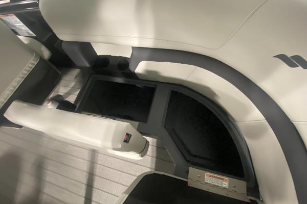 2024 Starcraft EXS 1 boat interior seating and storage compartments.