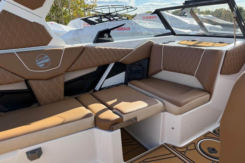 Luxurious interior of 2026 Tigé Z3 boat with brown leather seating.