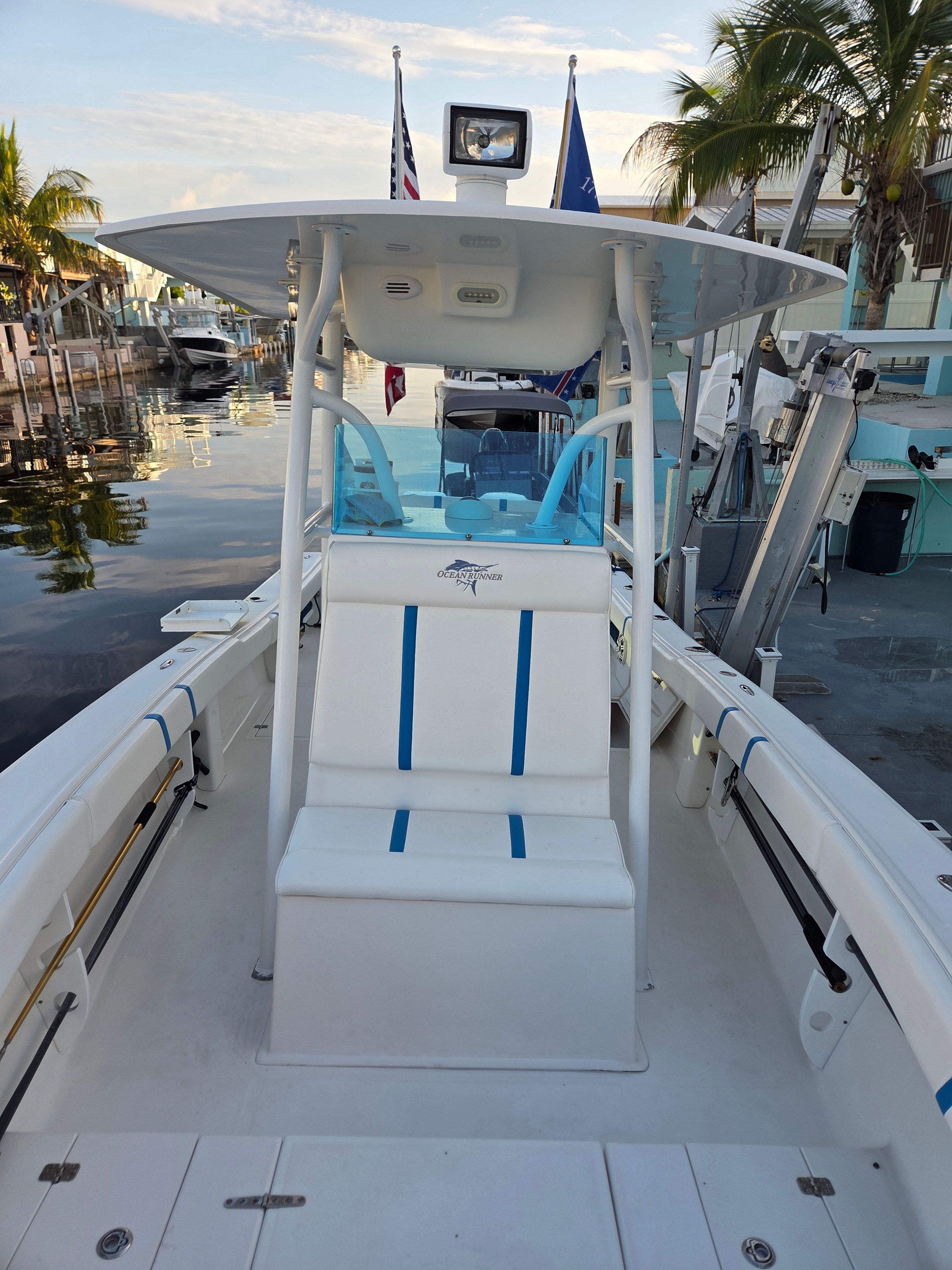 Ocean Runner 29 boat, 2012, docked with palm trees in the background.