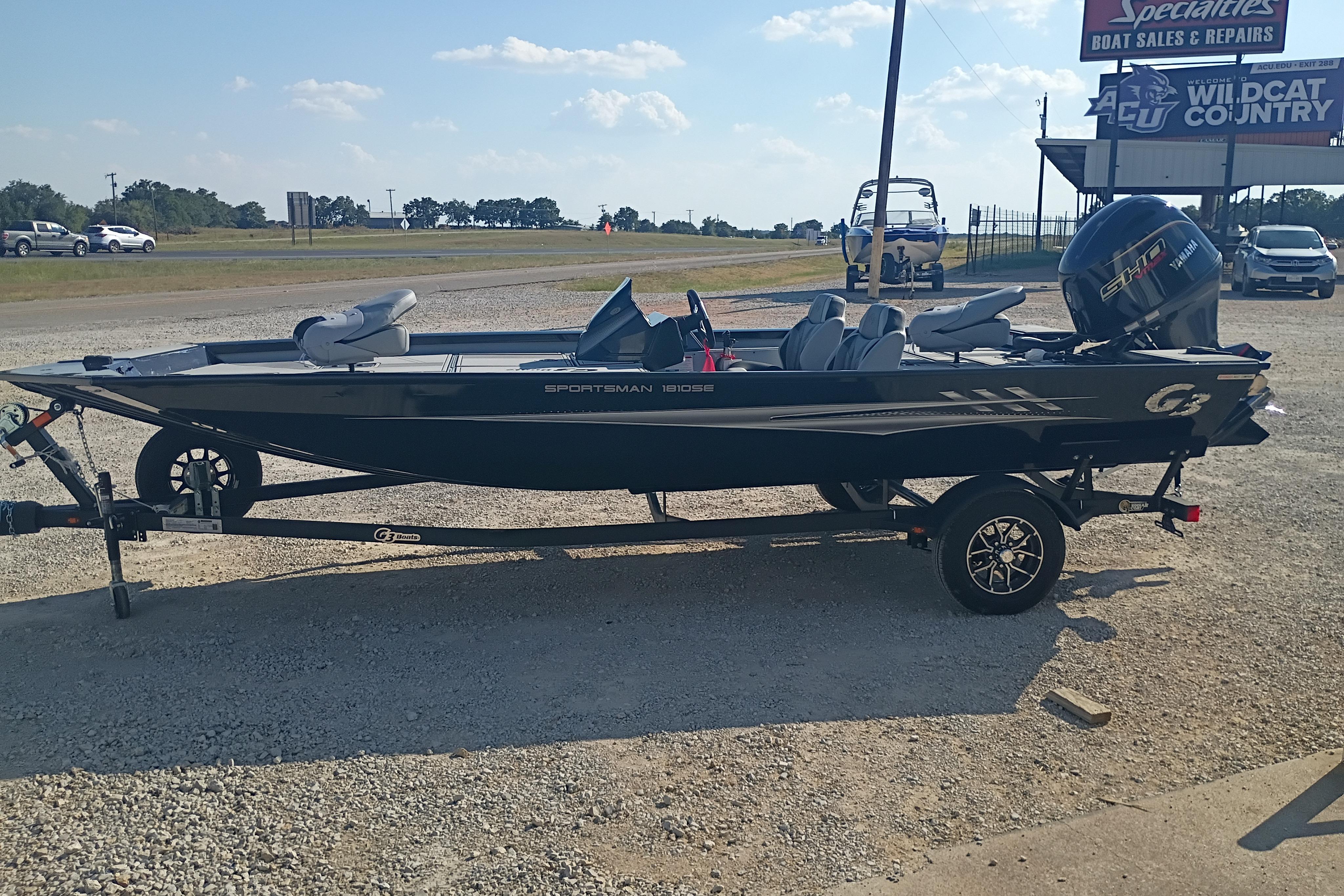 2026 G3 1810SE Sportsman boat on trailer at dealership, sunny day.
