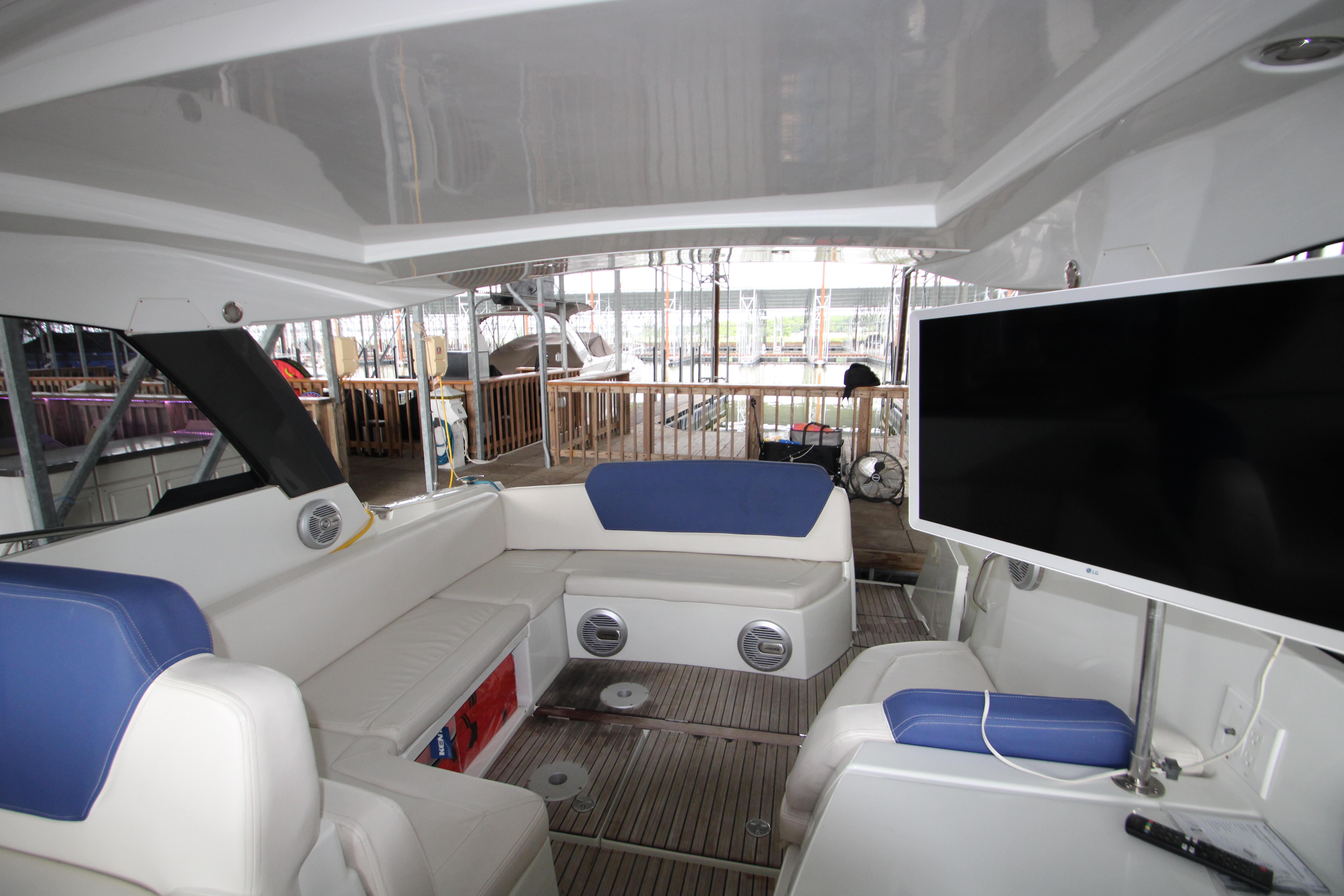 Interior of 2012 Jeanneau Leader 10 yacht with seating and TV.