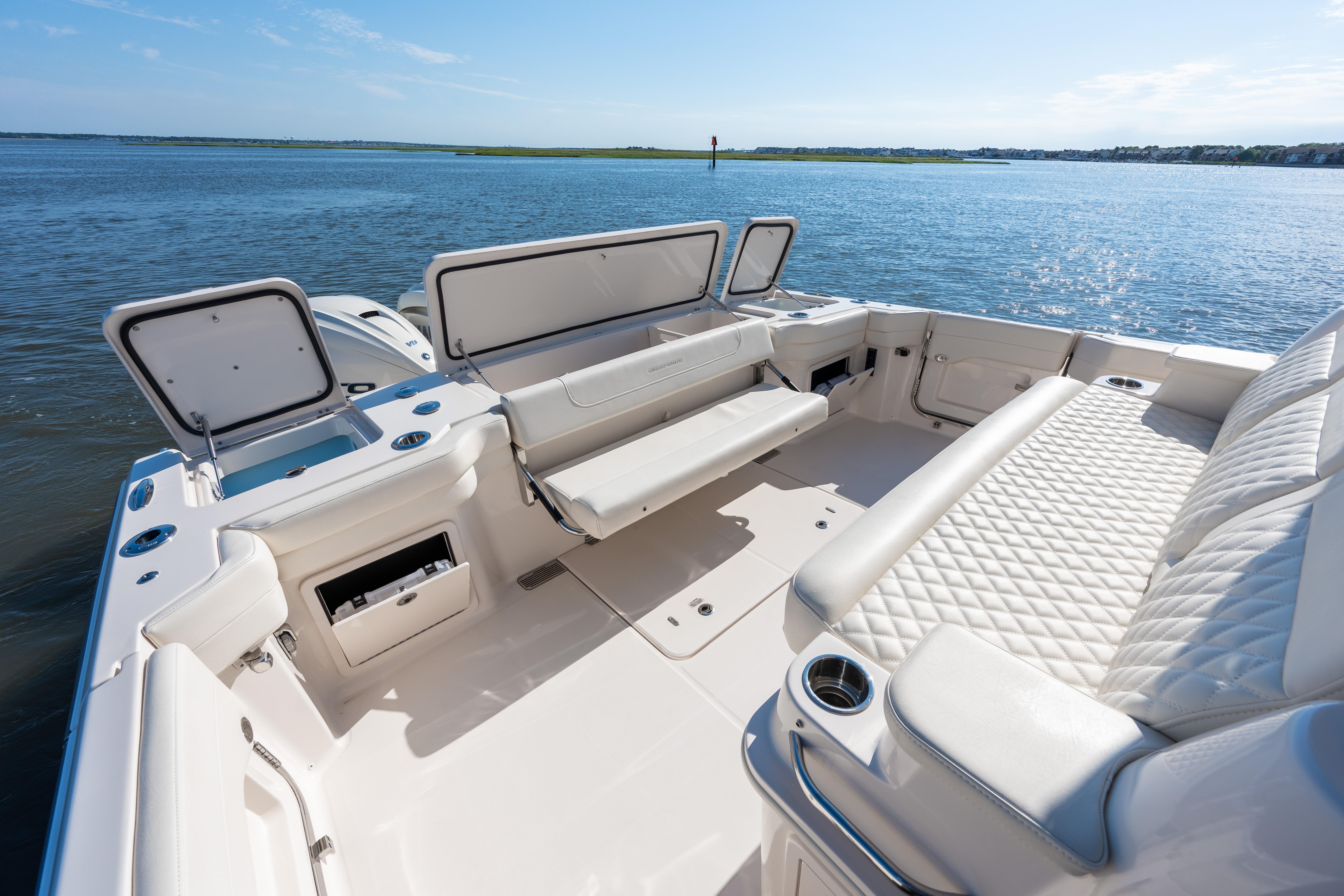 2025 Grady-White Canyon 386 boat interior with luxurious seating and open storage compartments.