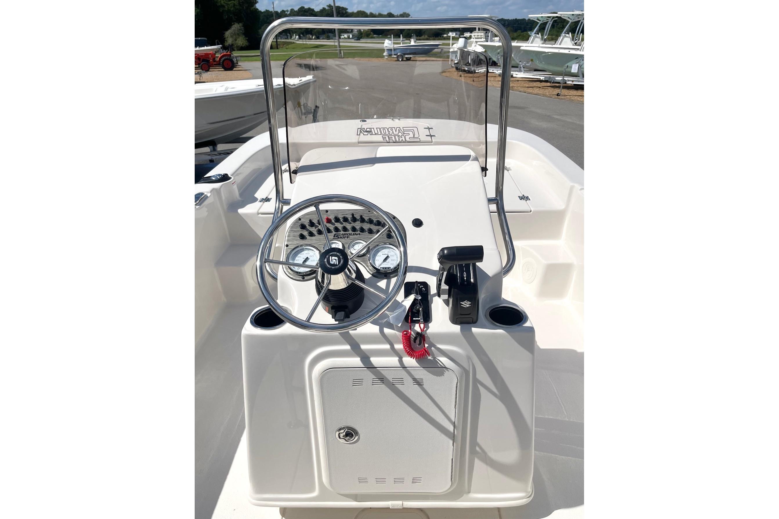 2026 Carolina Skiff 19 LS boat console with steering wheel and controls.