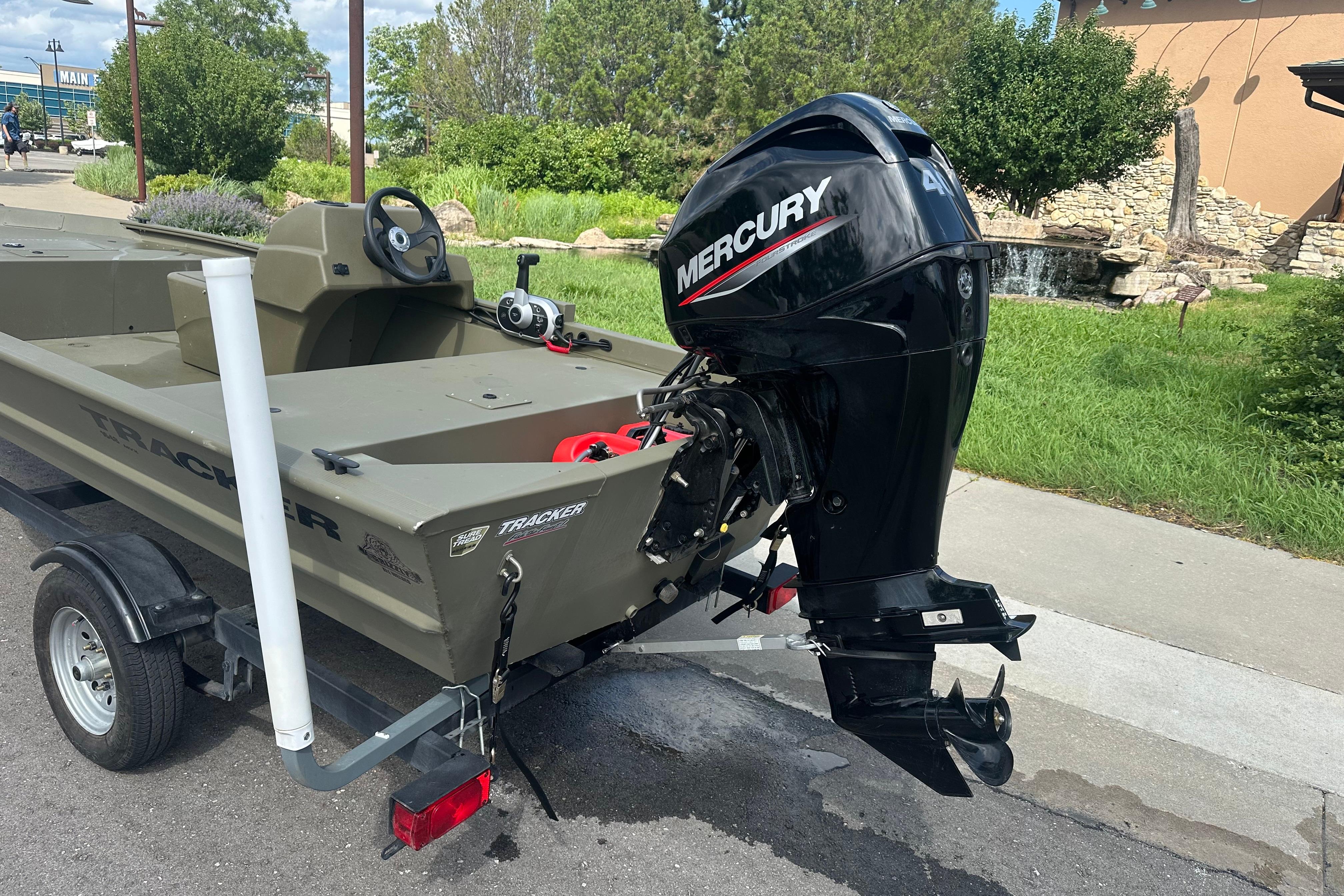 2024 Tracker Grizzly 1648 SC boat with Mercury outboard motor on trailer.