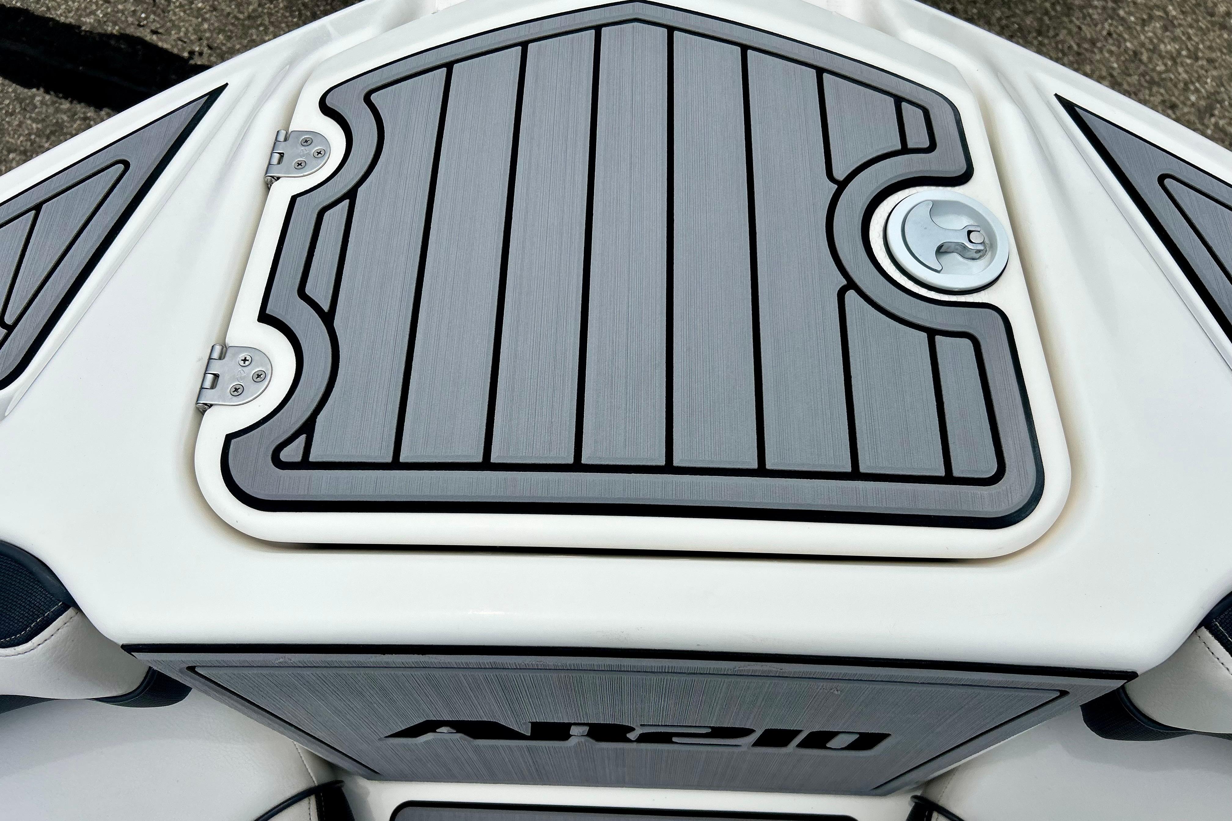 2015 Yamaha Boats AR210 deck with sleek gray paneling and secure latch.