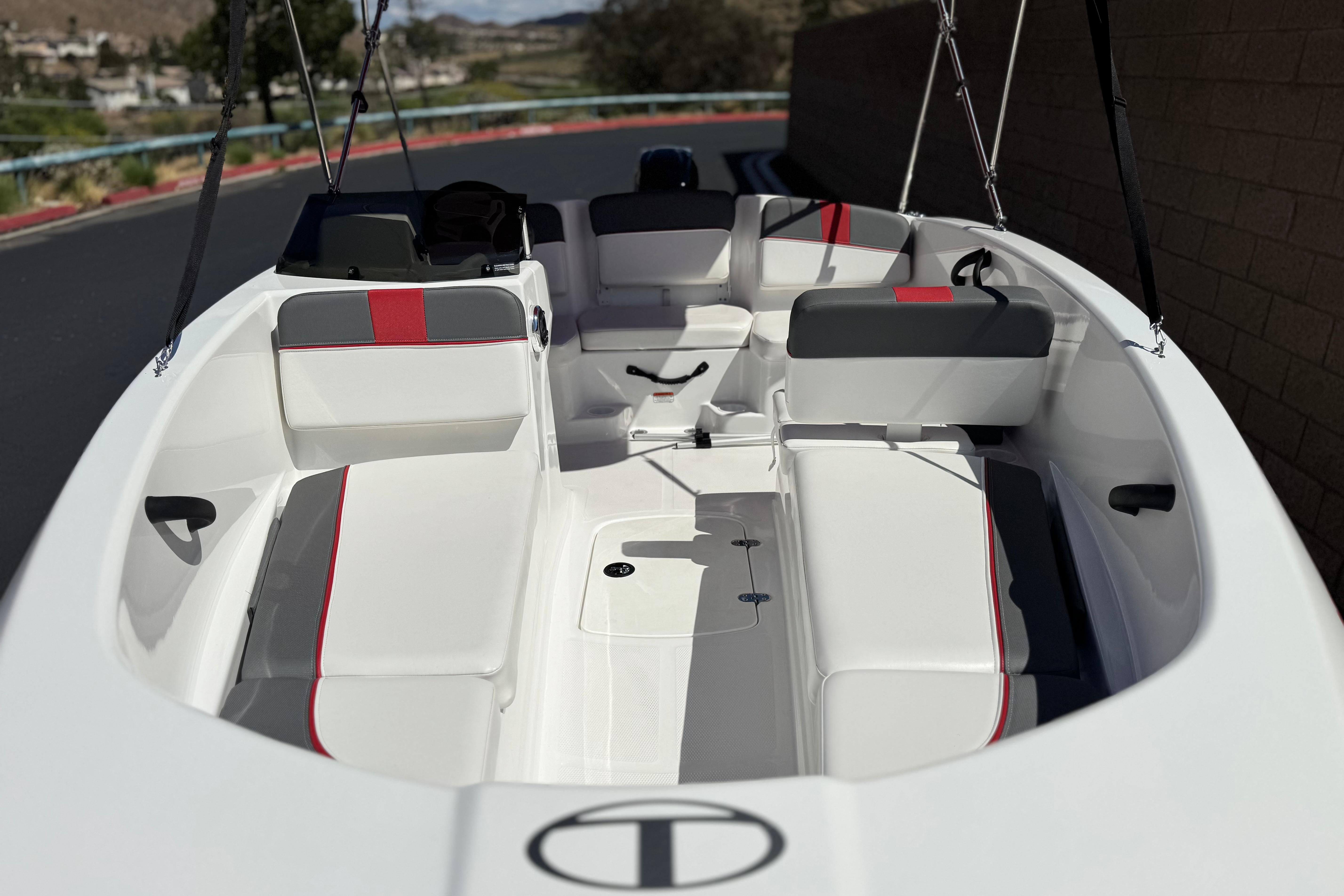 2024 Tahoe T16 boat interior with white and red seating, sleek design.