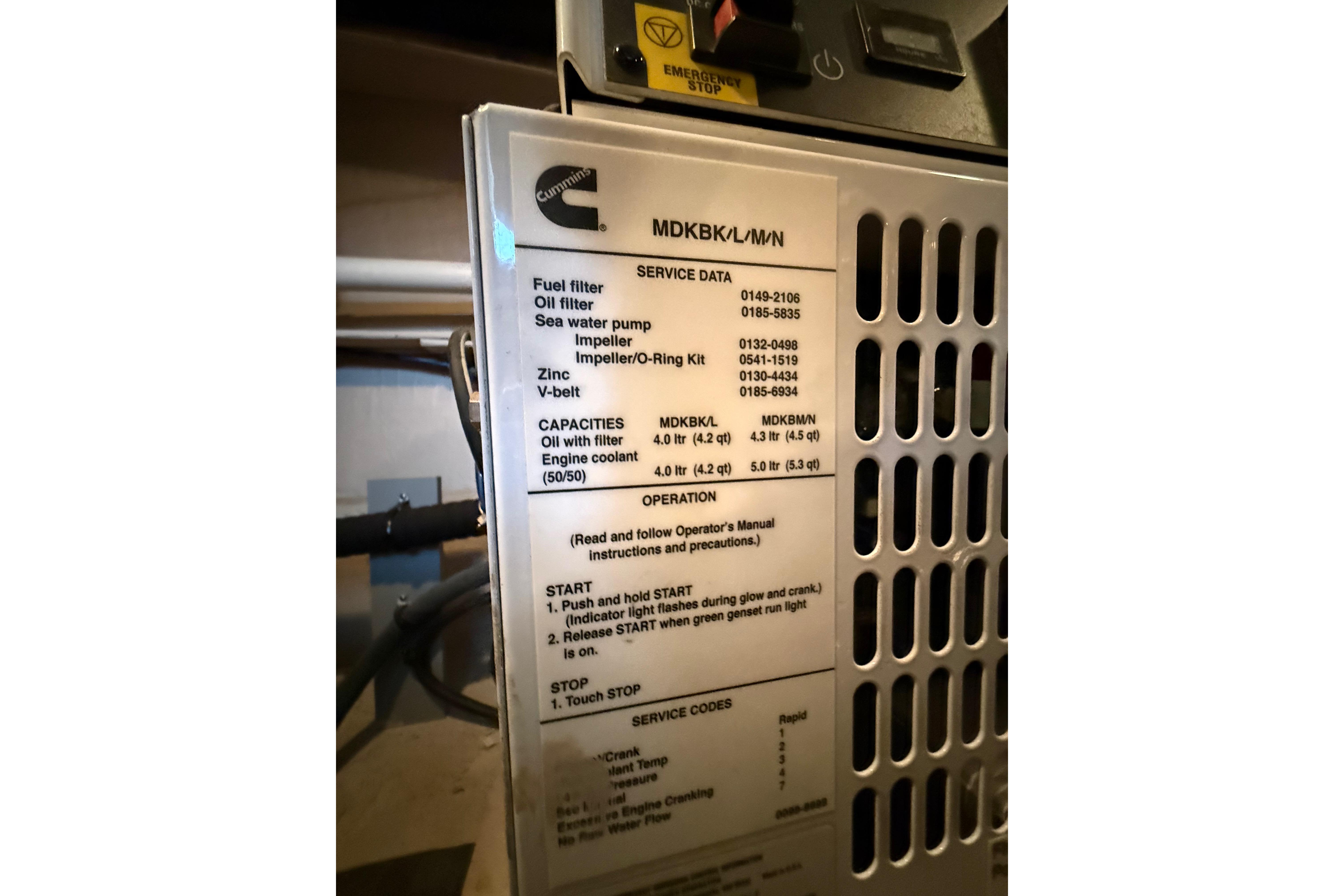 Engine service panel with maintenance data for Cummins generator on 2016 Sea Ray Sundancer 510.