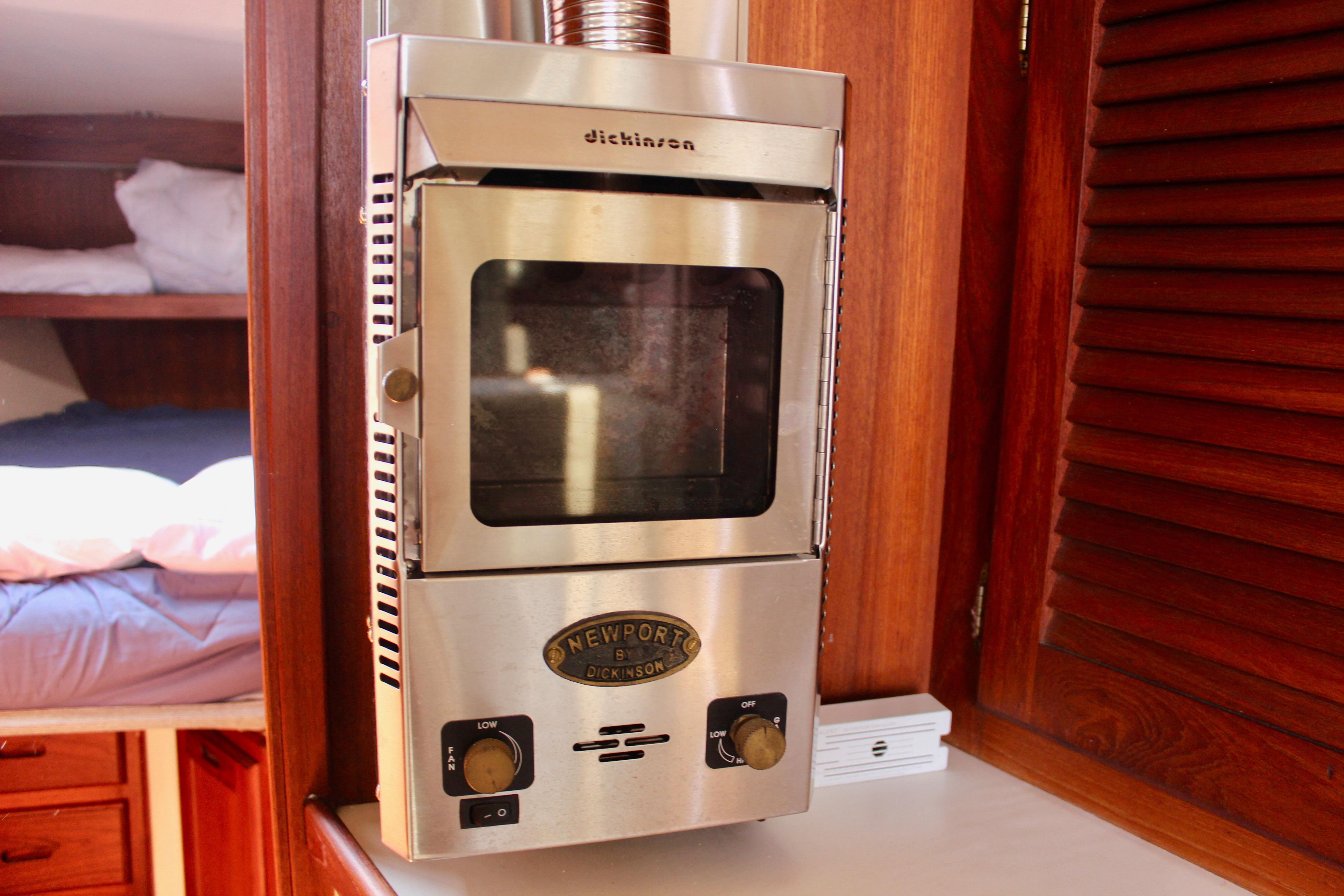 Stainless steel heater inside 1989 Catalina 36 yacht cabin with wooden interior.
