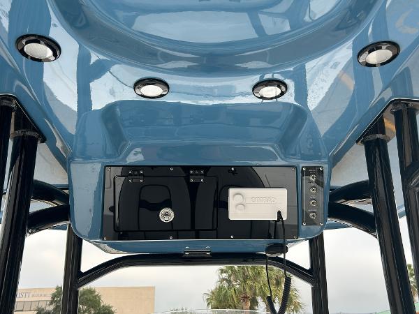 2024 Sea Pro 250 DLX boat console with blue finish and integrated lighting.