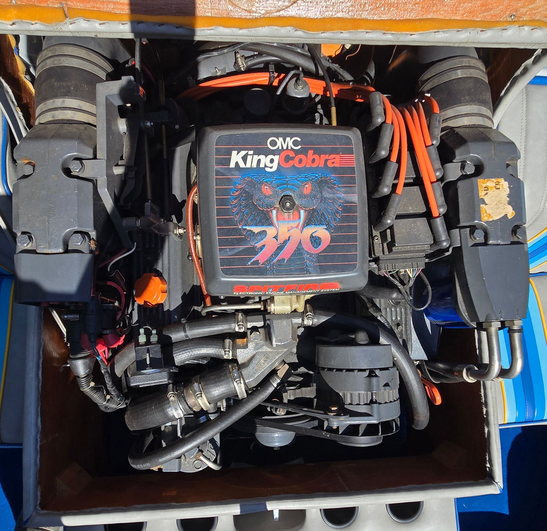 Engine compartment of a 1990 Sanger Ski Sanger with an OMC King Cobra 370 engine.