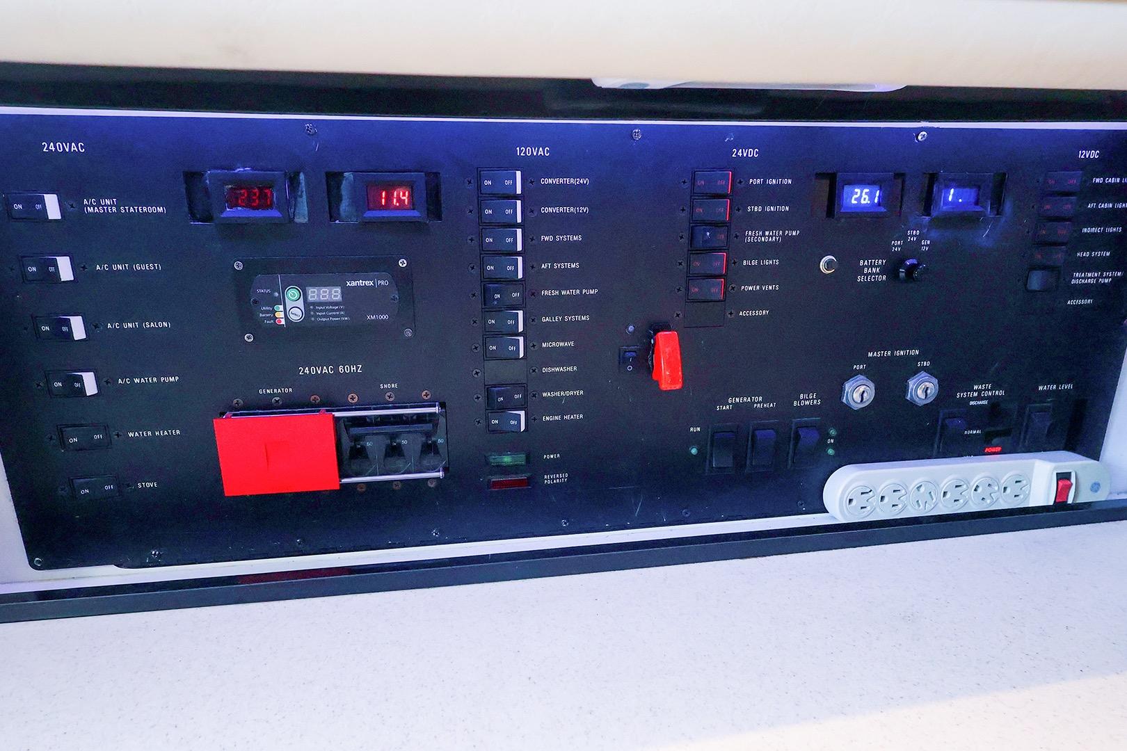 Control panel of a 1998 Sea Ray 500 Sundancer yacht, featuring various switches and gauges.