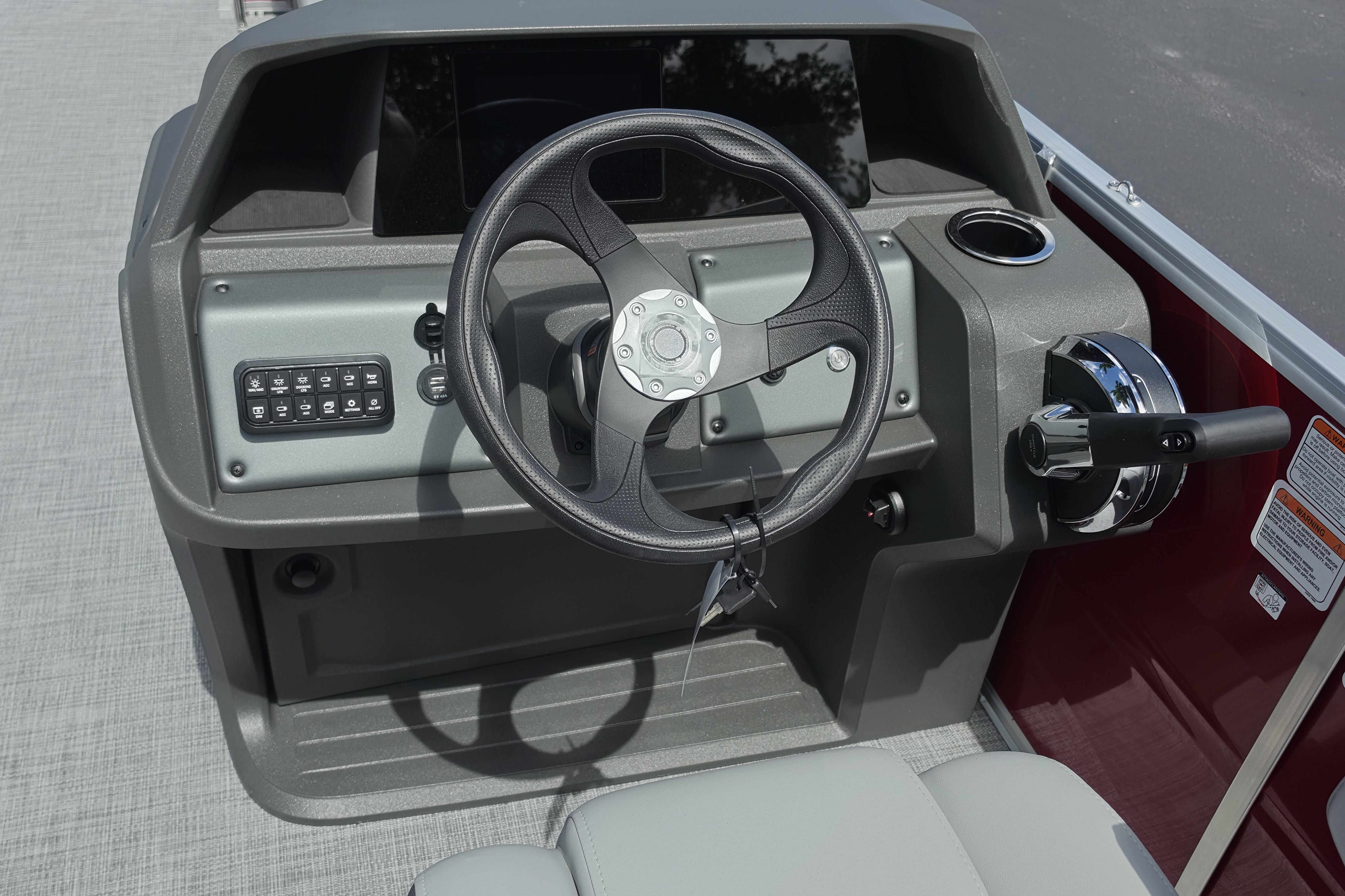 Steering console of 2026 Sun Tracker Party Barge 18 DLX pontoon boat.