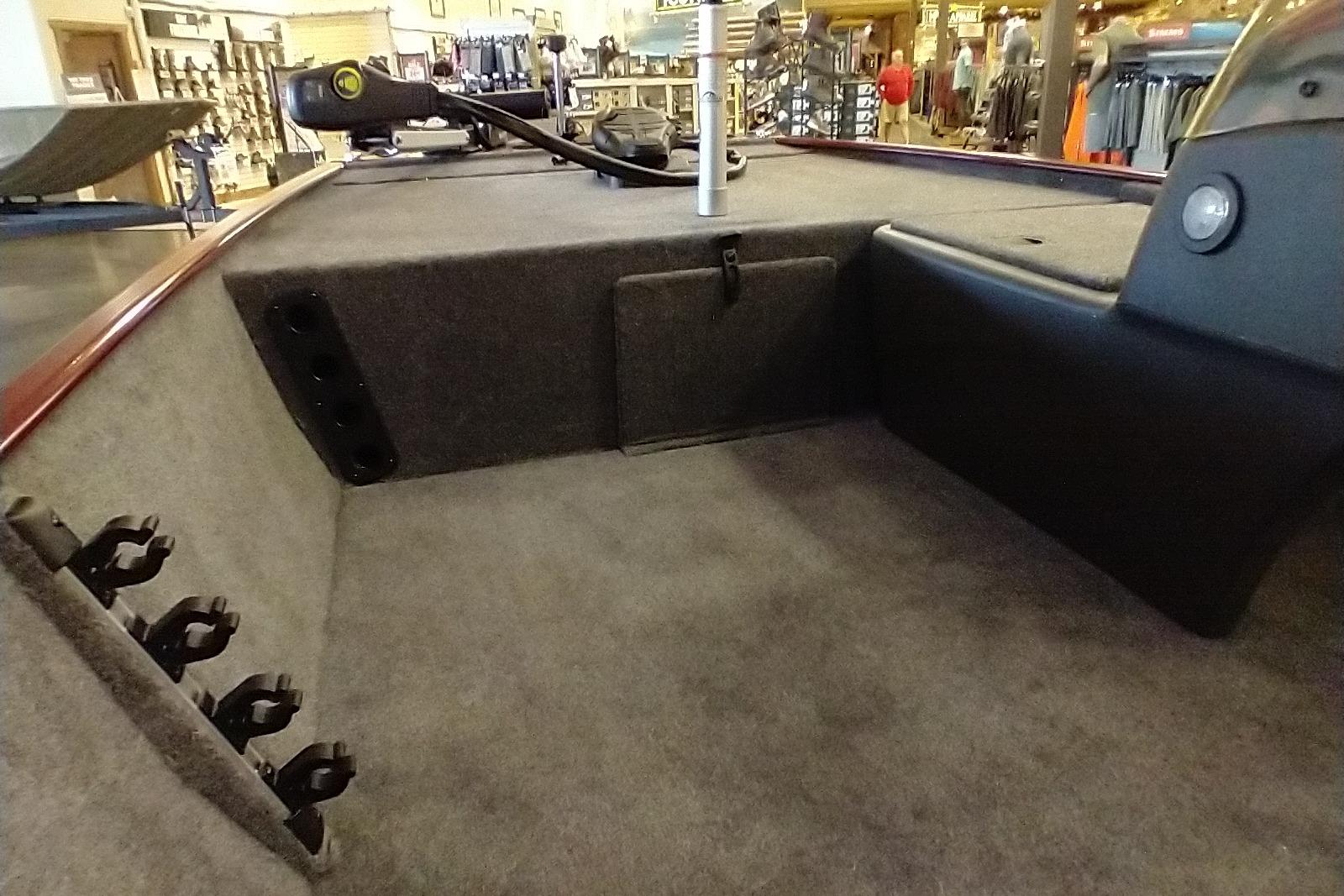 2026 Tracker Bass Tracker Classic XL boat interior with rod holders and carpeted deck.