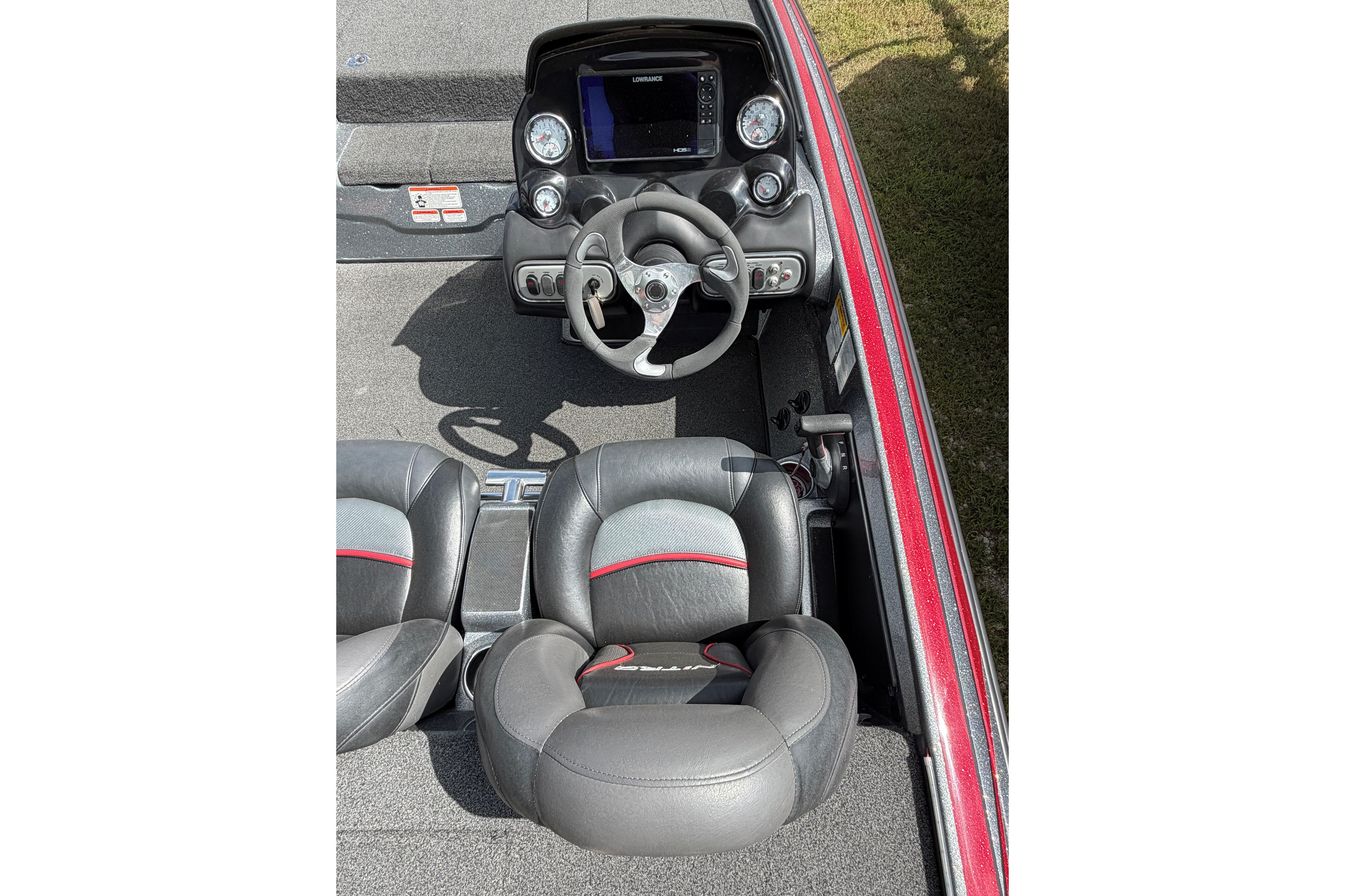 Interior of a 2015 Nitro Z-8 boat featuring steering wheel and dual seats.