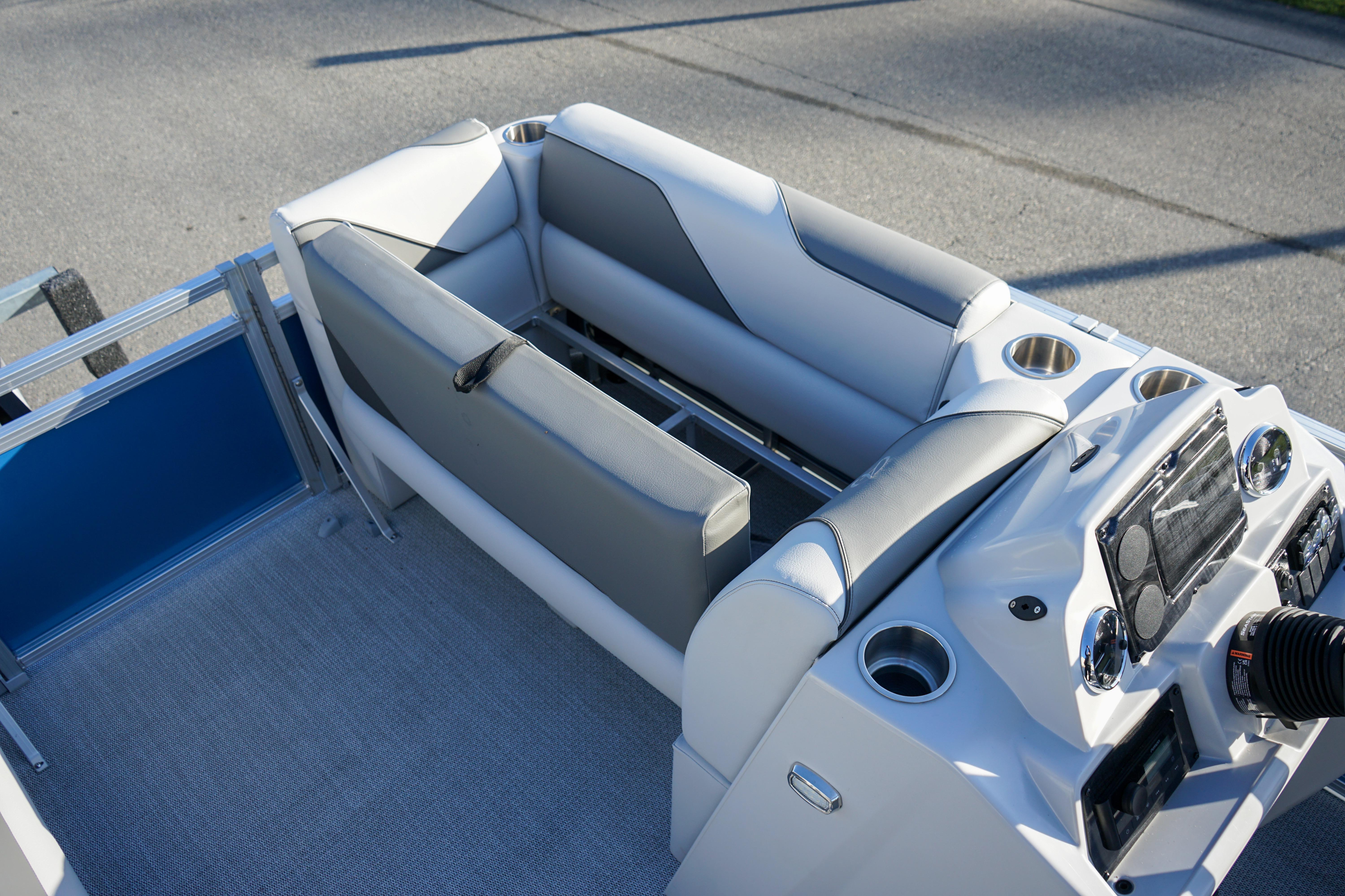 2024 Avalon 17 Venture Cruise boat interior with seating and control panel.