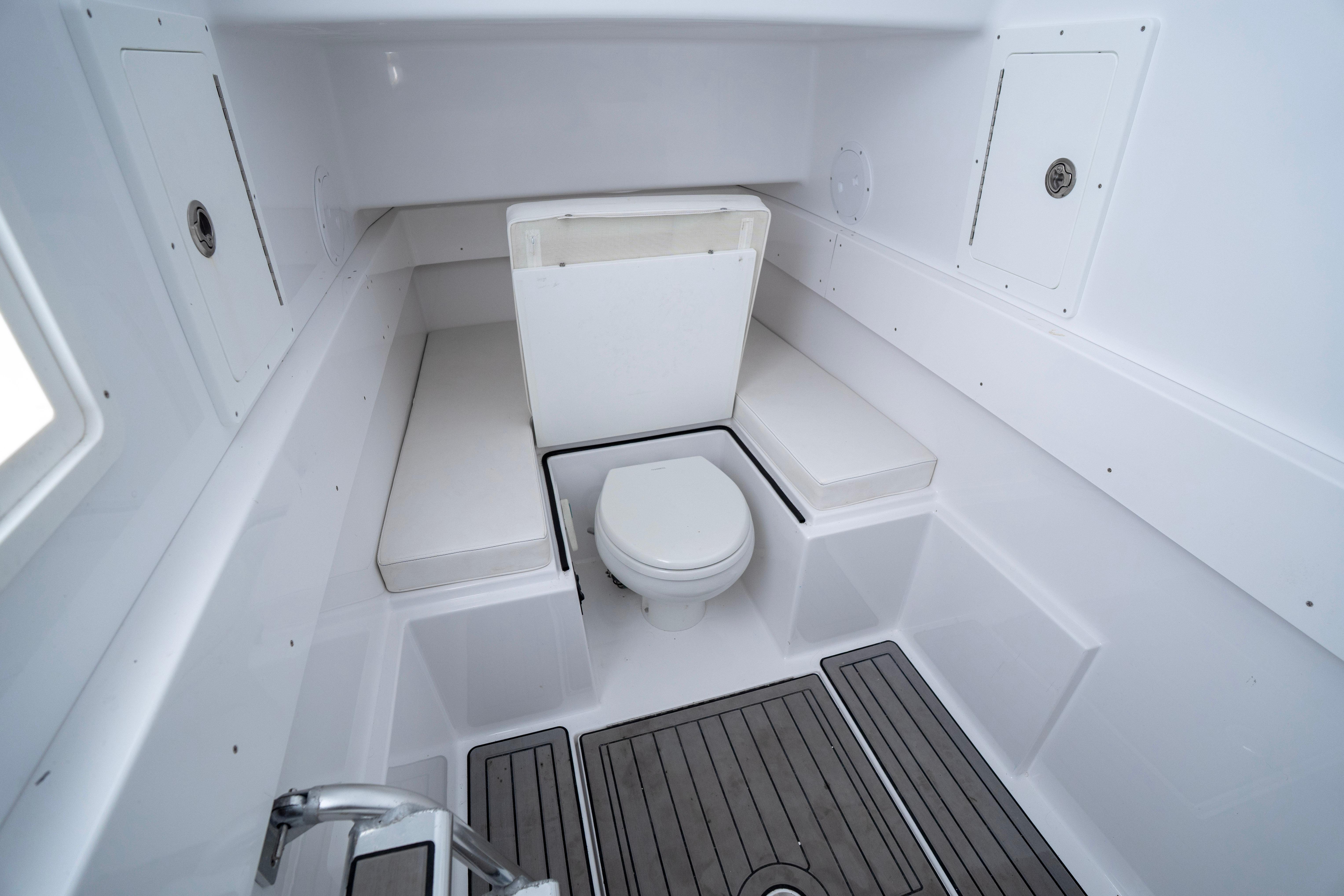 2021 Onslow Bay 41 Tournament Edition boat interior with toilet and seating.