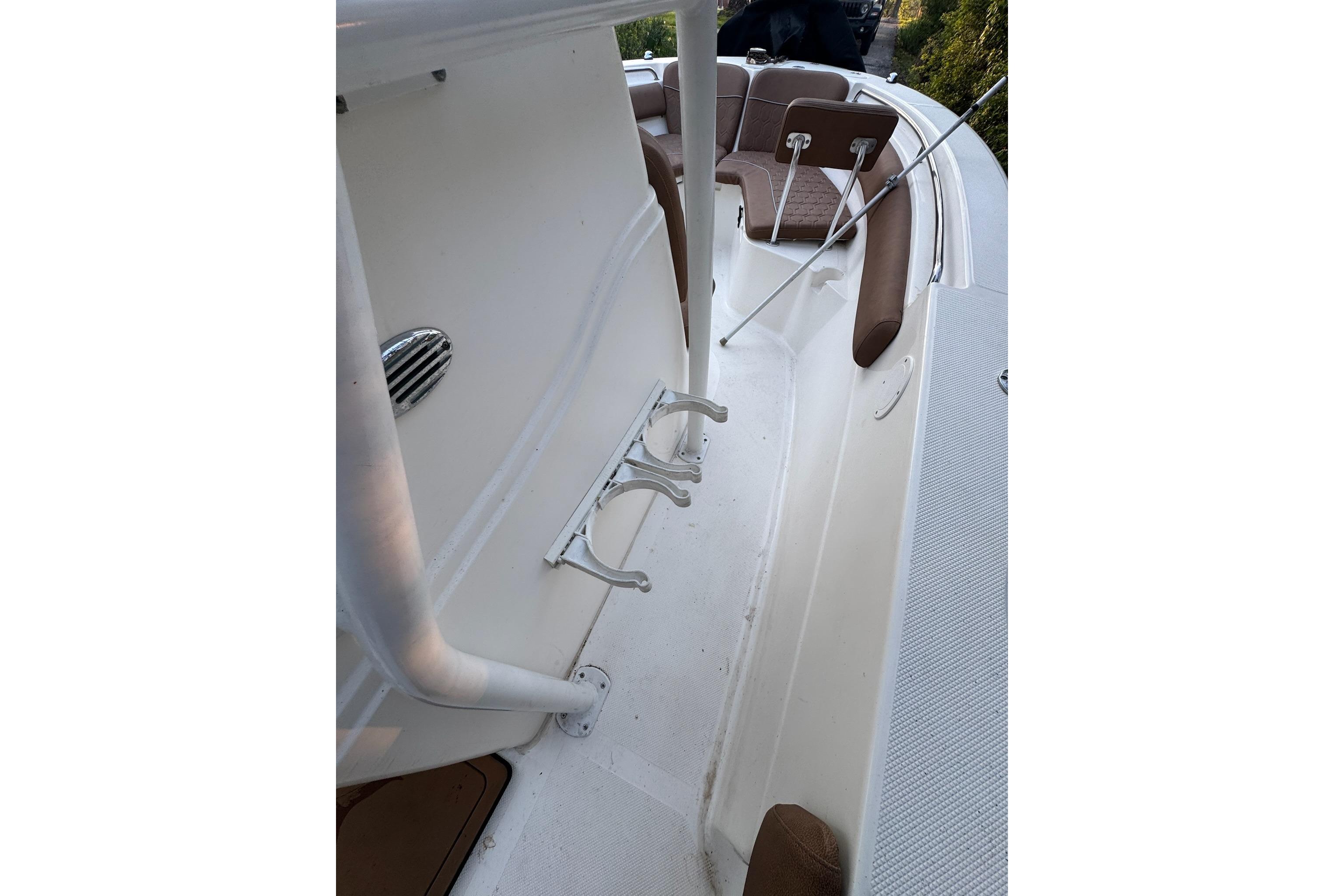 2013 Sea Fox 246 Commander boat interior with seating and rod holders.