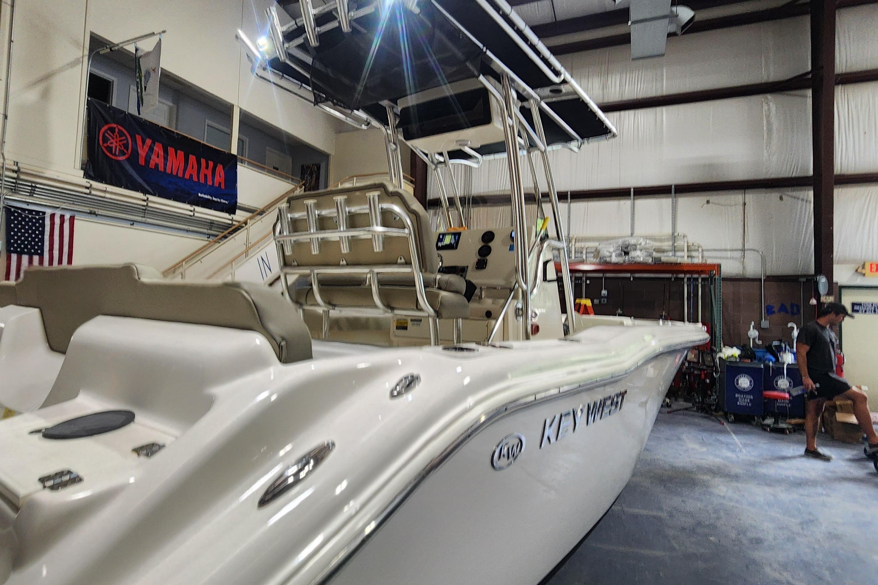 2023 Key West 219 FS boat in a workshop, featuring Yamaha branding.
