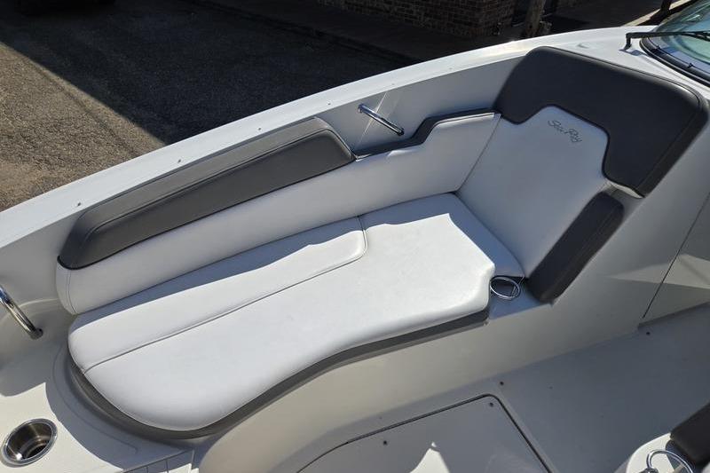 2011 Sea Ray 300 Sundeck boat interior with white and gray cushioned seating.