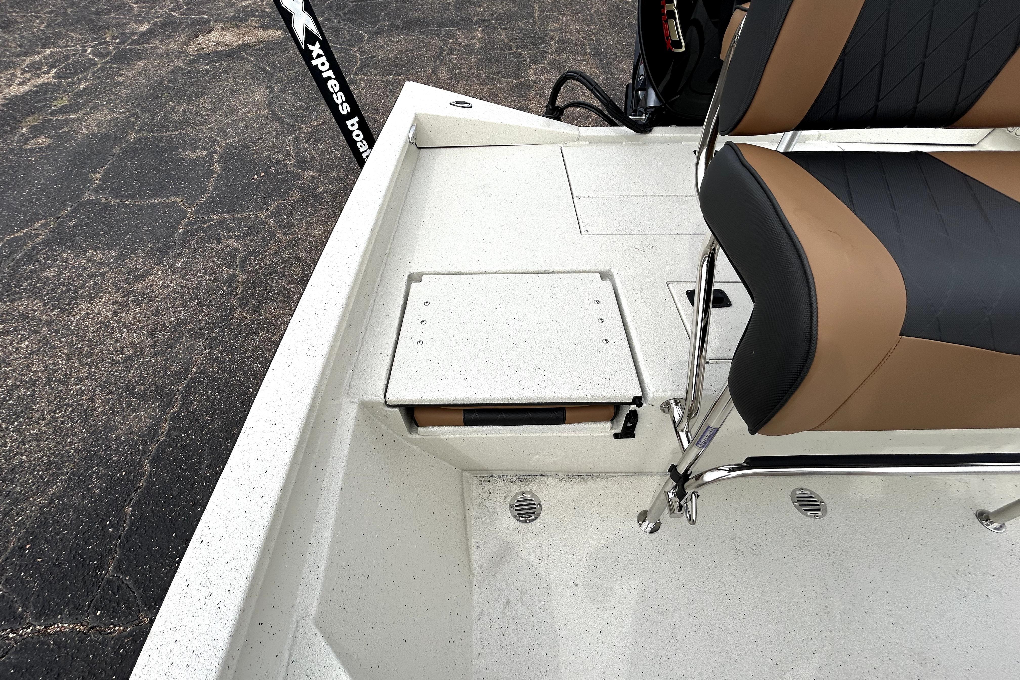 2026 Xpress H20B Bay boat interior with seating and storage compartments.