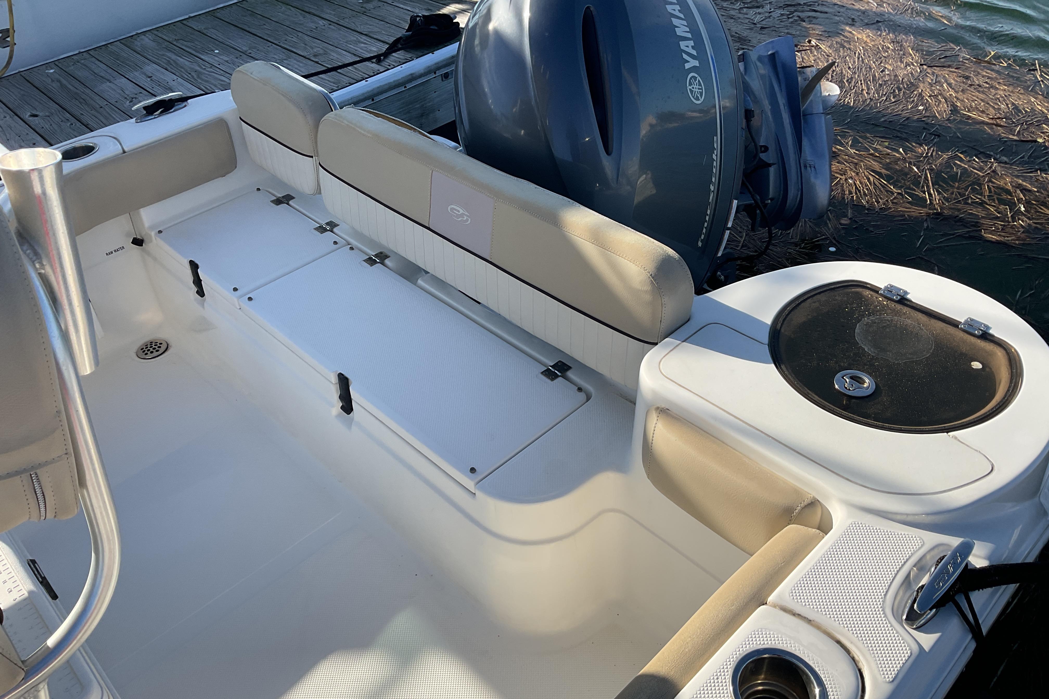 2016 Sea Fox 226 Commander boat interior with Yamaha engine, featuring seating and storage.