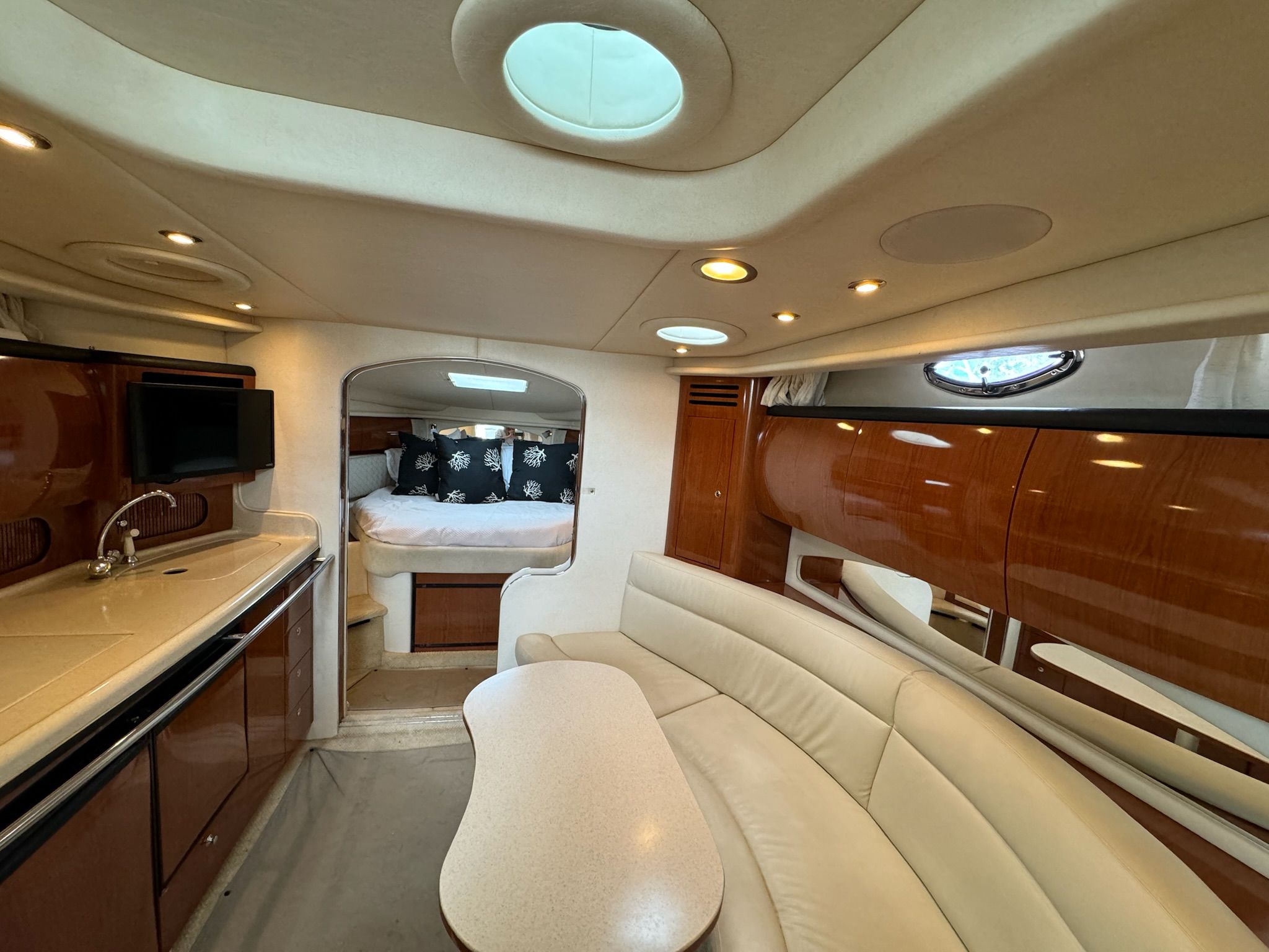Interior of 2002 Sea Ray 360 Sundancer with elegant furnishings.