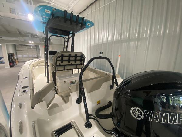 2024 Key West 219 FS boat with Yamaha engine in indoor storage.