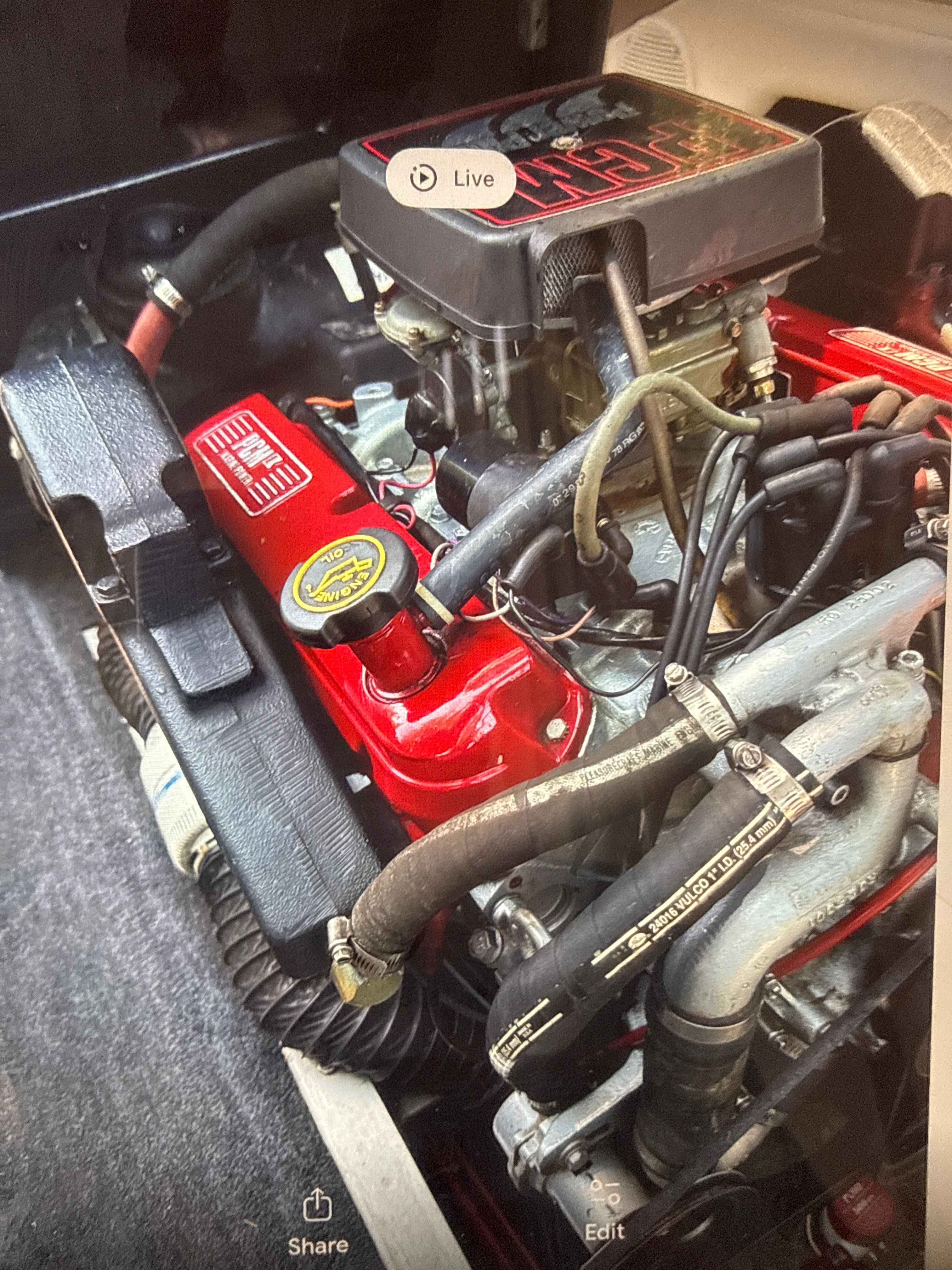 Engine of a 1990 Correct Craft Ski Nautique boat, close-up view.
