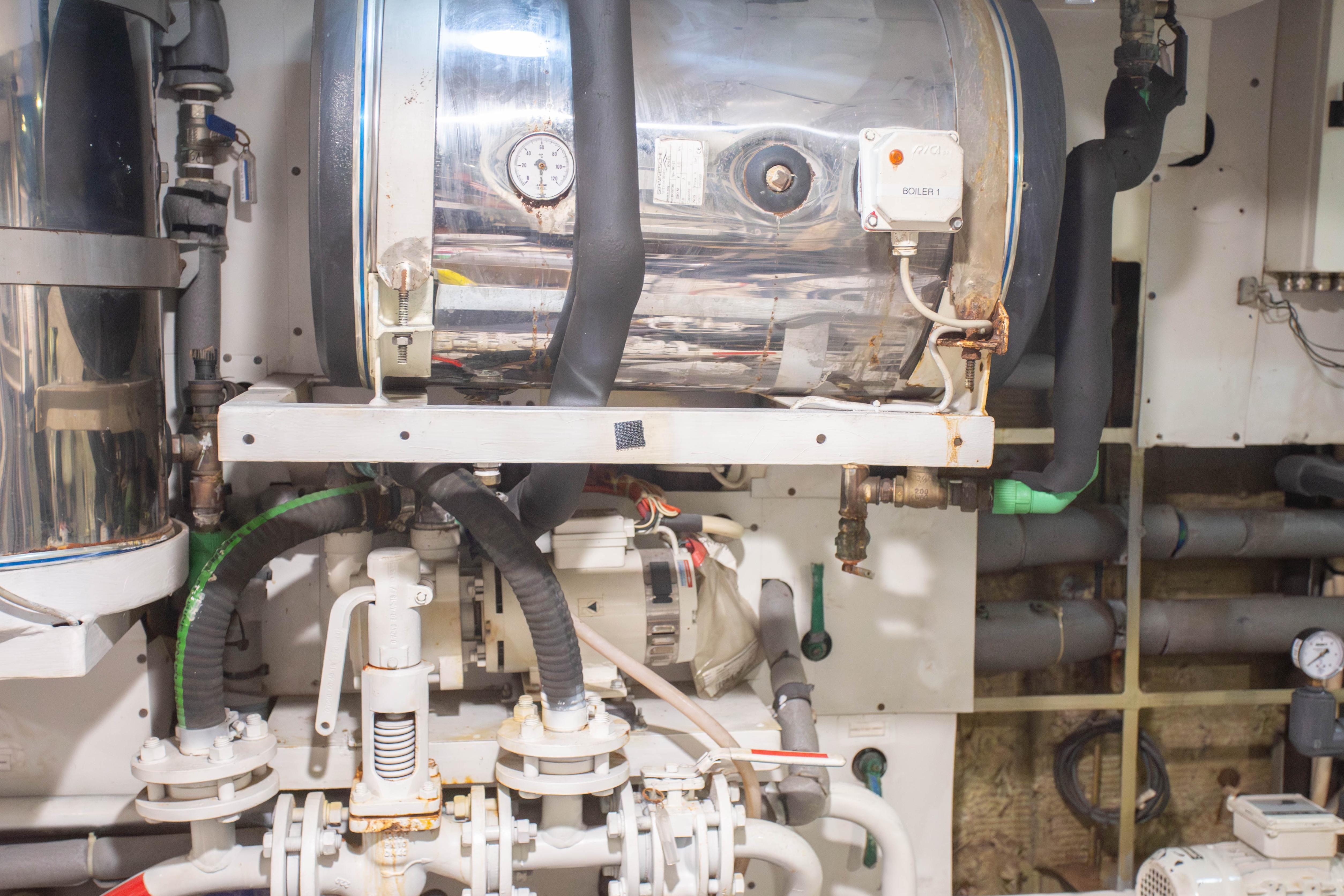 Engine room of 2014 Fifth Ocean Yachts 24m Displacement Explorer Yacht, featuring mechanical equipment.