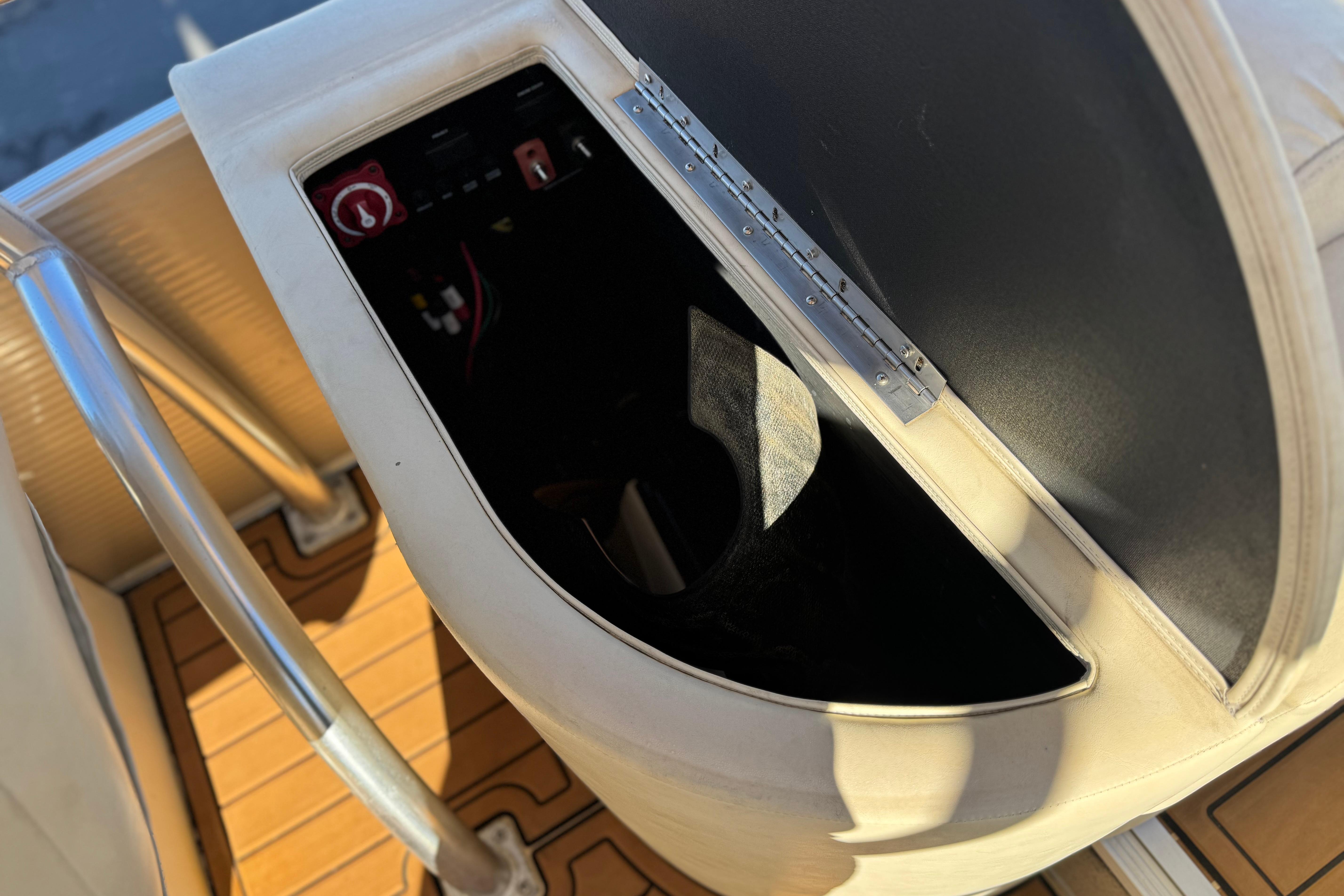 2013 Bennington 2575QCW I/O boat interior with control panel and seating area.