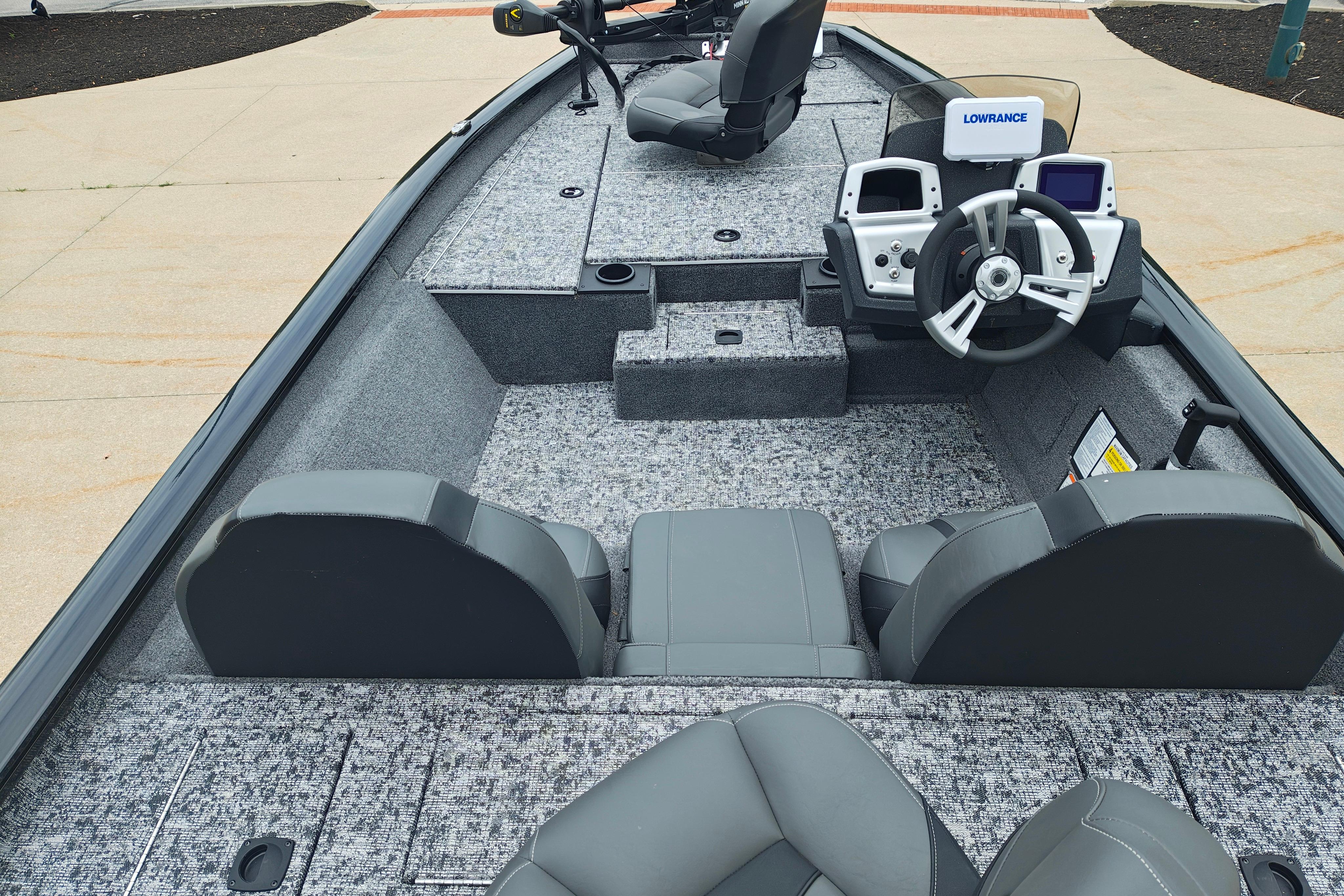 2026 Tracker Pro Team 175 boat interior with steering console and seating.