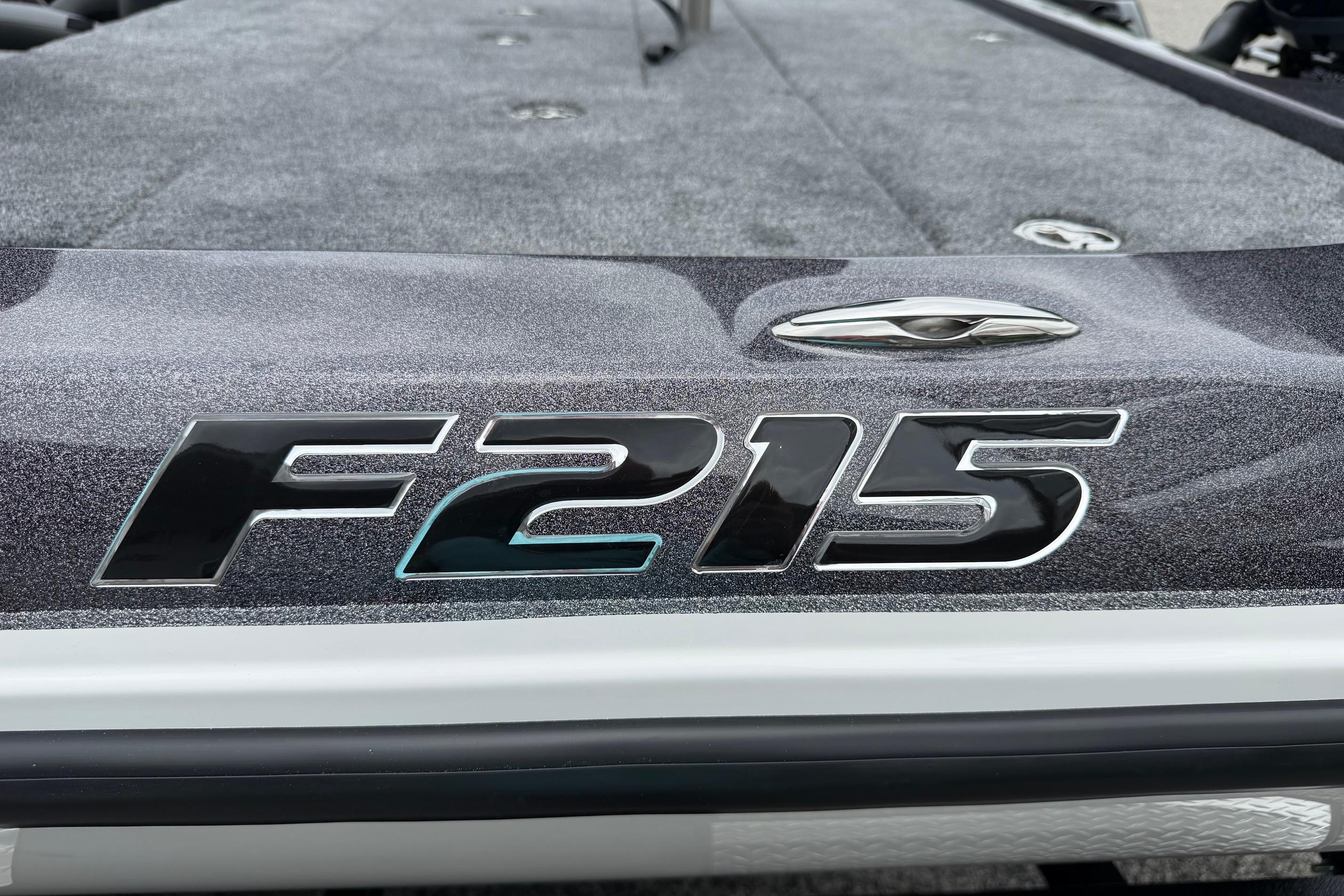 2027 Falcon Boats F215 model emblem on a textured surface.