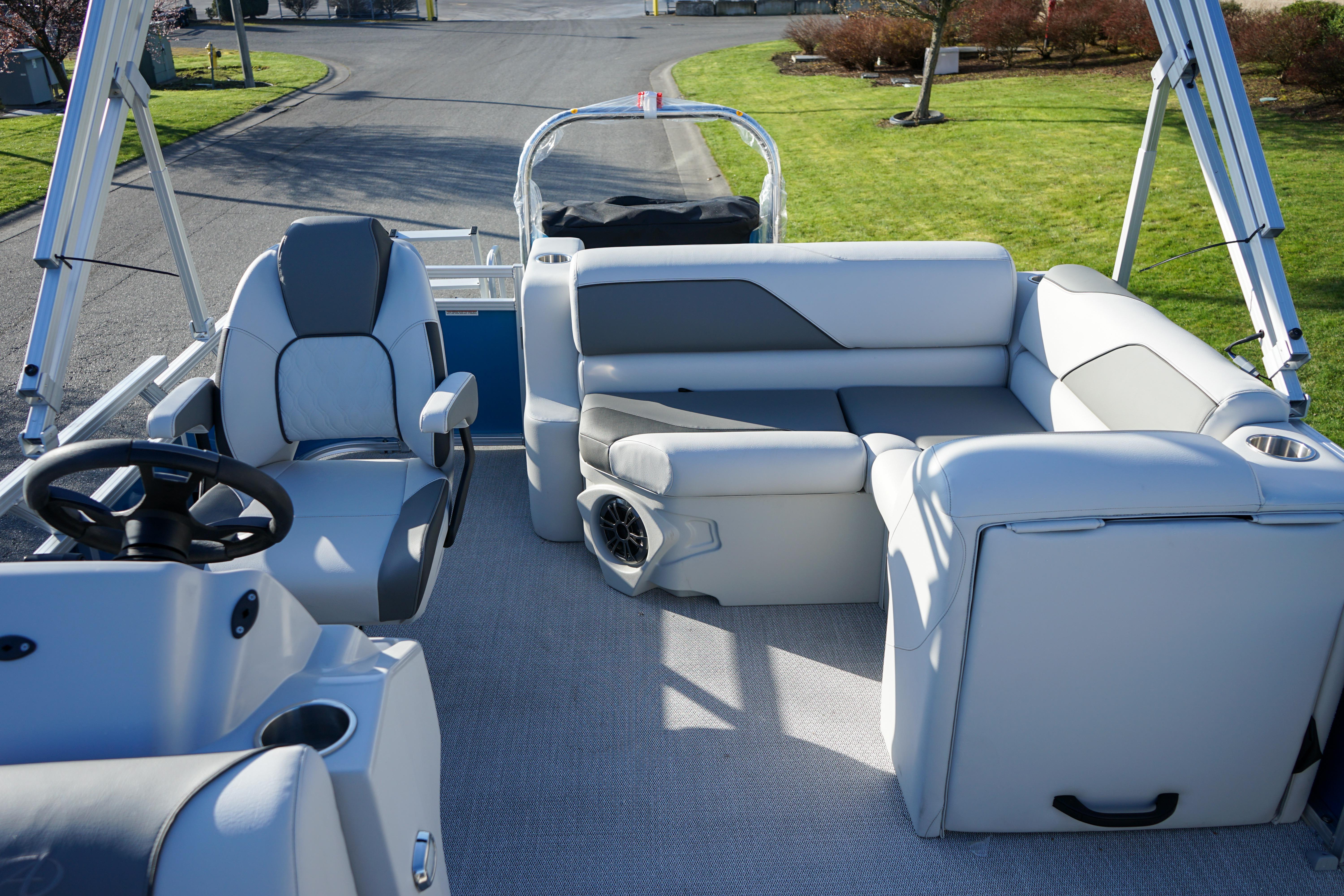 2024 Avalon 17 Venture Cruise boat interior with plush seating and modern steering console.