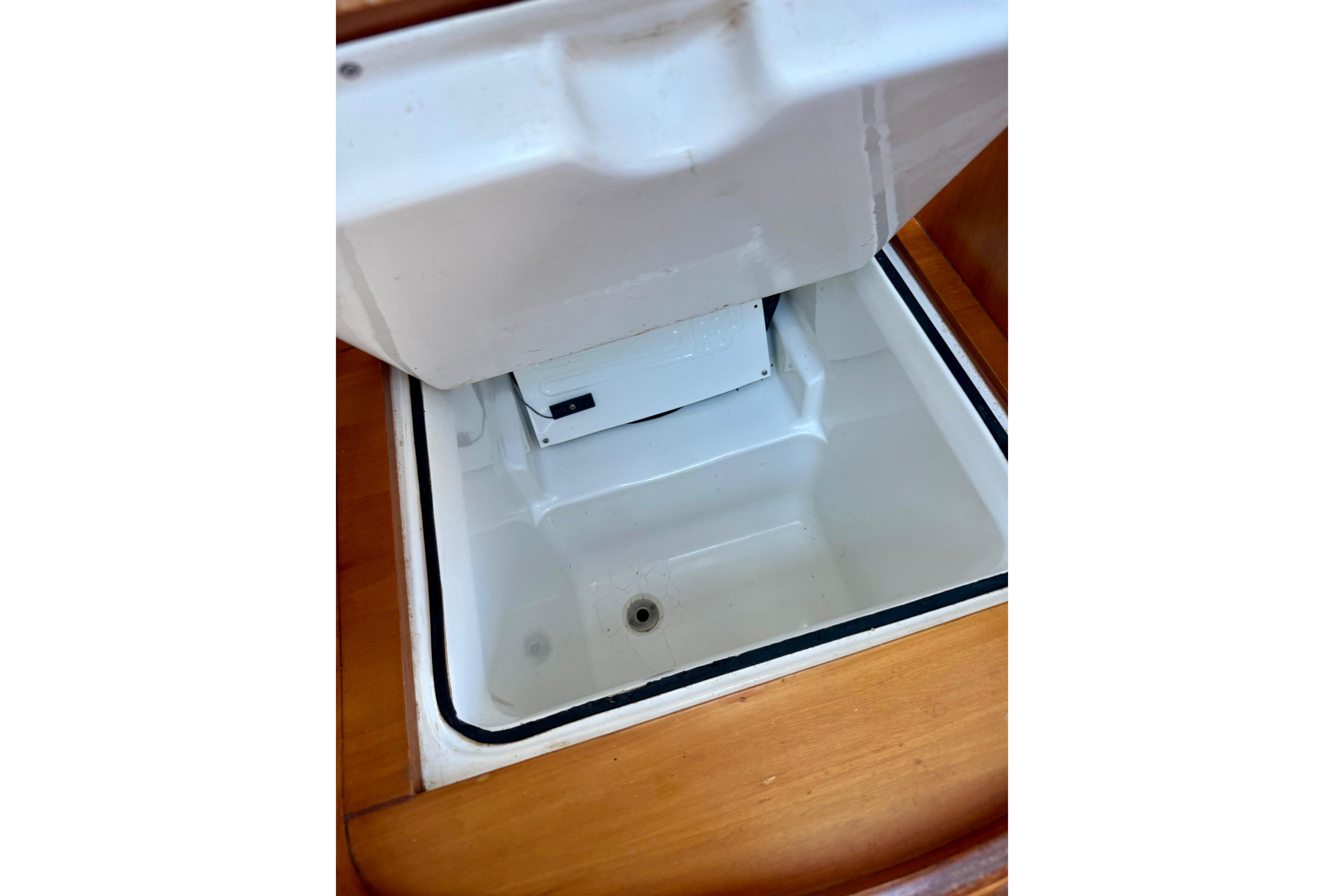 Open storage compartment on 2002 Beneteau Oceanis Clipper 311 sailboat.