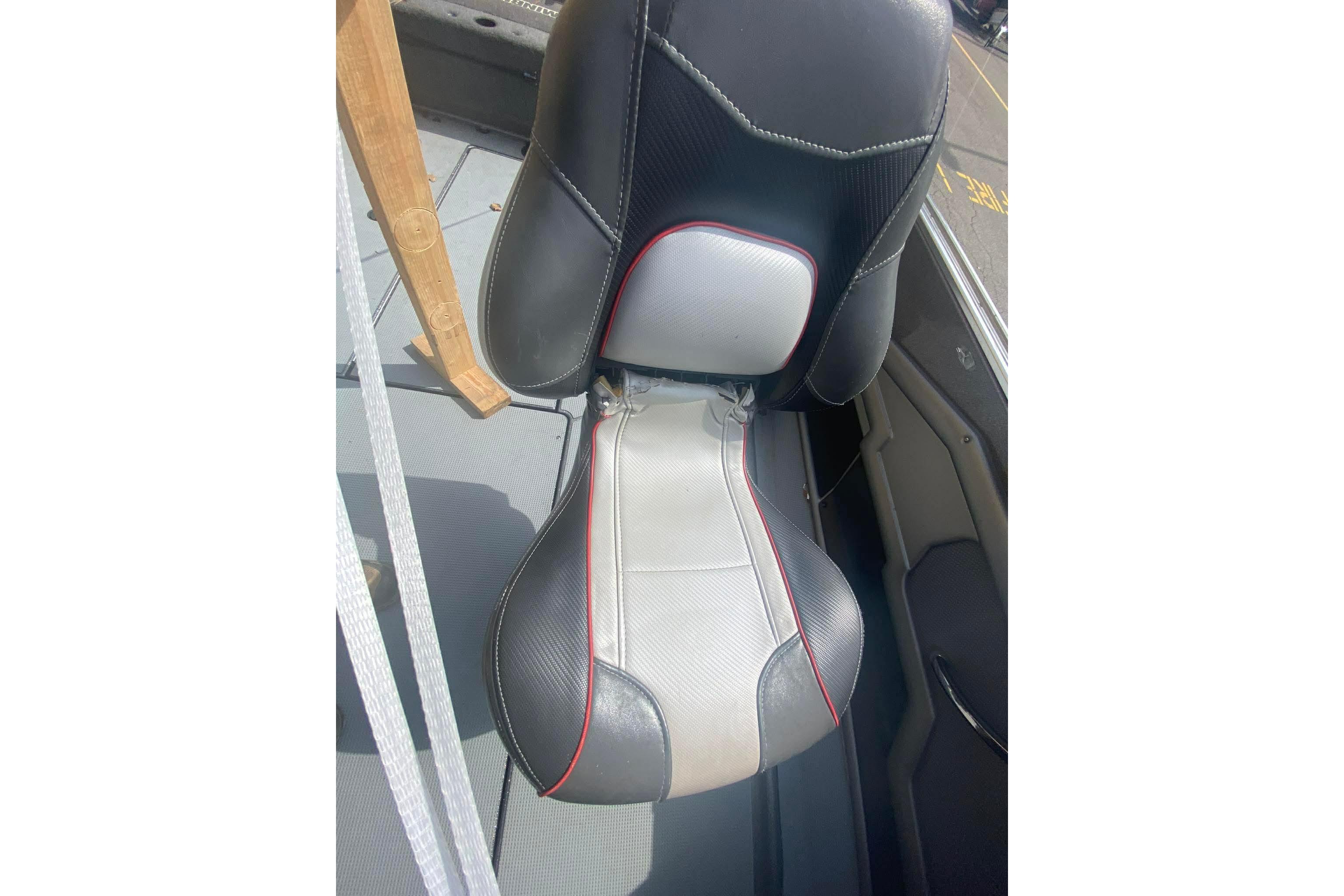 2017 Ranger 621FS Fisherman boat seat, black and gray with red accents, in a fishing vessel.