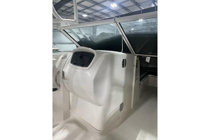 2022 Robalo R247 Dual Console boat interior with sleek white design and modern dashboard.