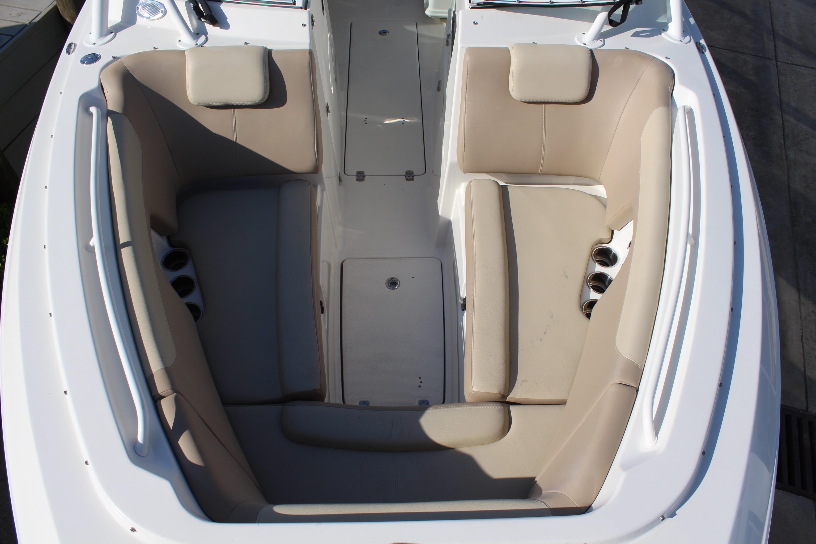 2017 Sailfish 275 DC boat interior with beige seating and cup holders.