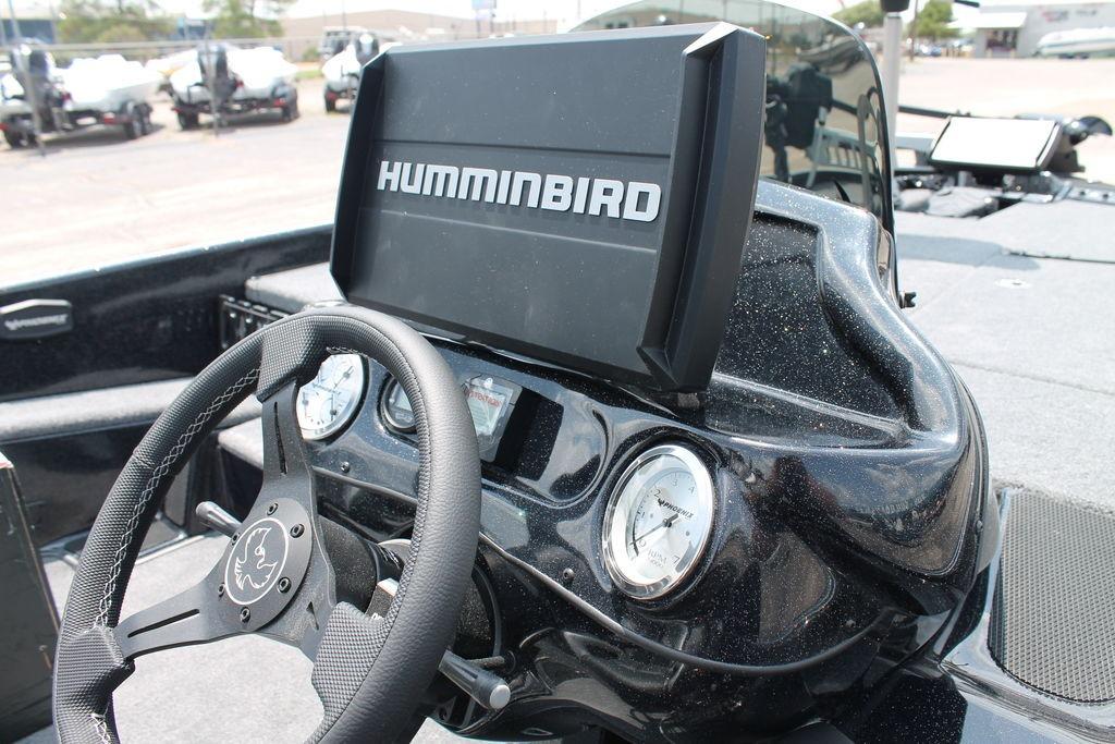Dashboard of 2025 Phoenix 920 Elite boat with Humminbird display and gauges.