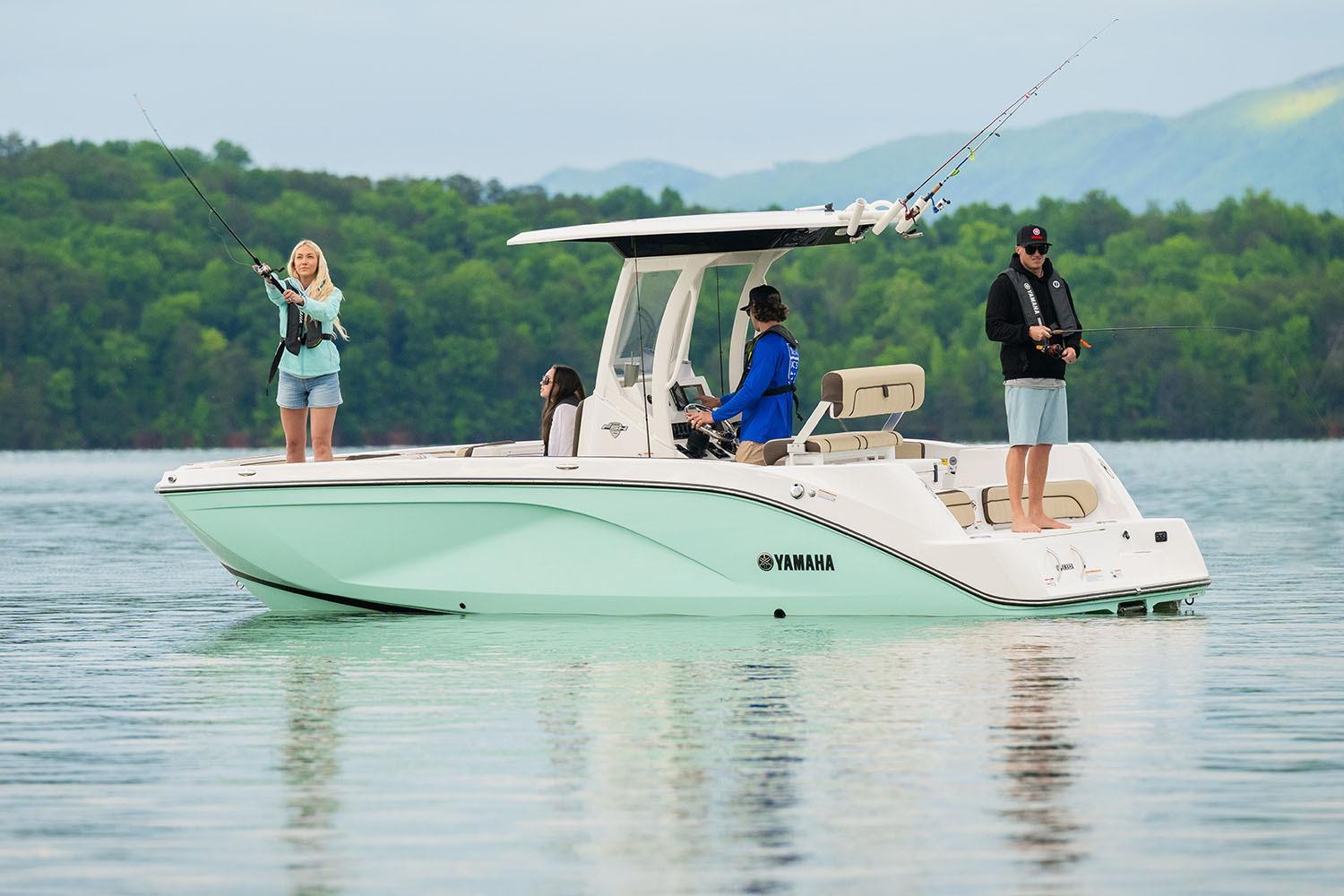 Manufacturer Provided Image: 2026 Yamaha Boats 222 FSH Sport E on a serene lake, people fishing.