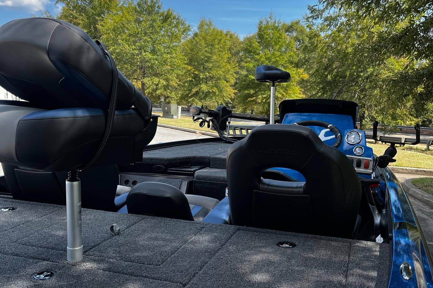 Interior of a 2025 Nitro Z18 boat with seating and control panel.