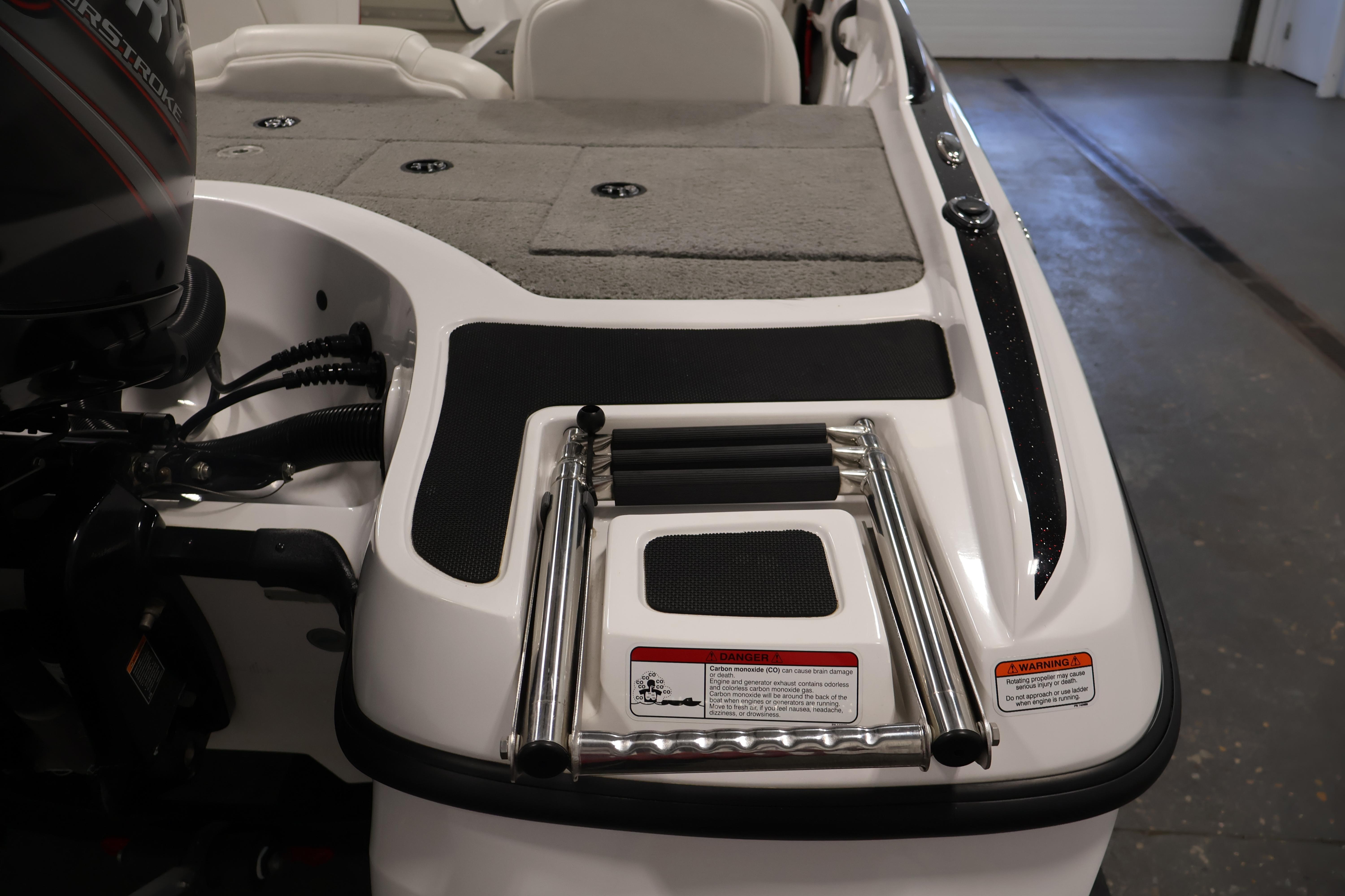 2019 Nitro Z19 Sport boat with motor and foldable ladder on deck.