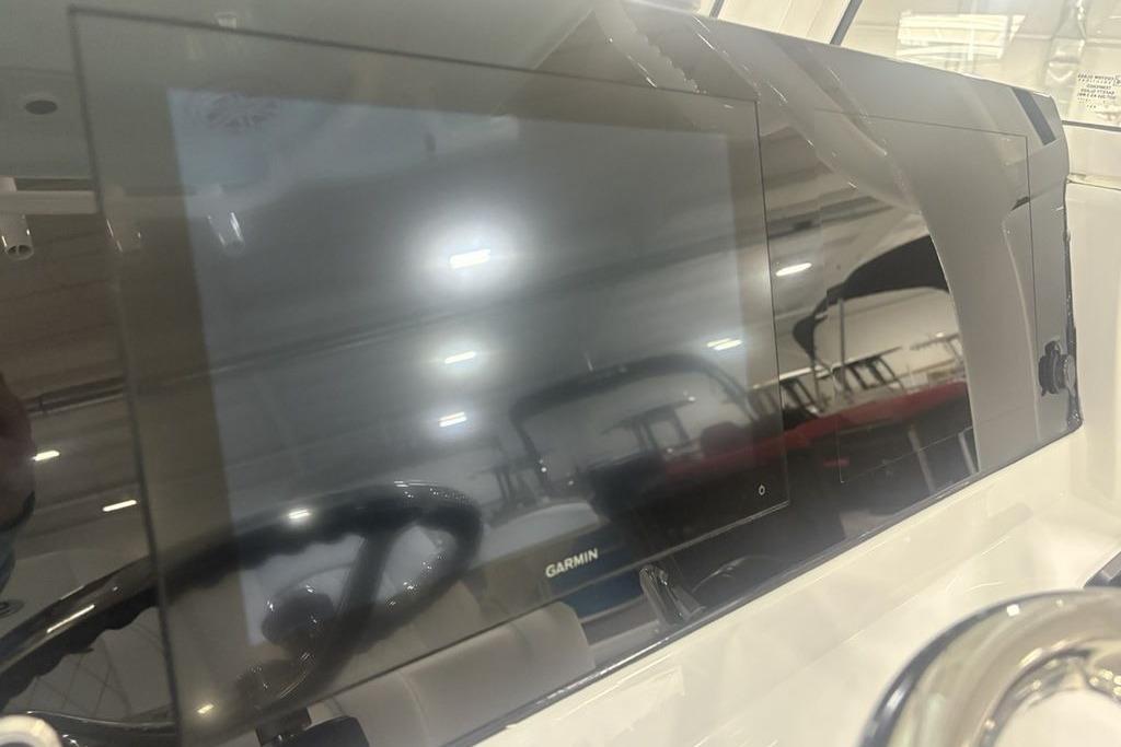 Dashboard of 2026 Sportsman Masters 227 boat with Garmin display.