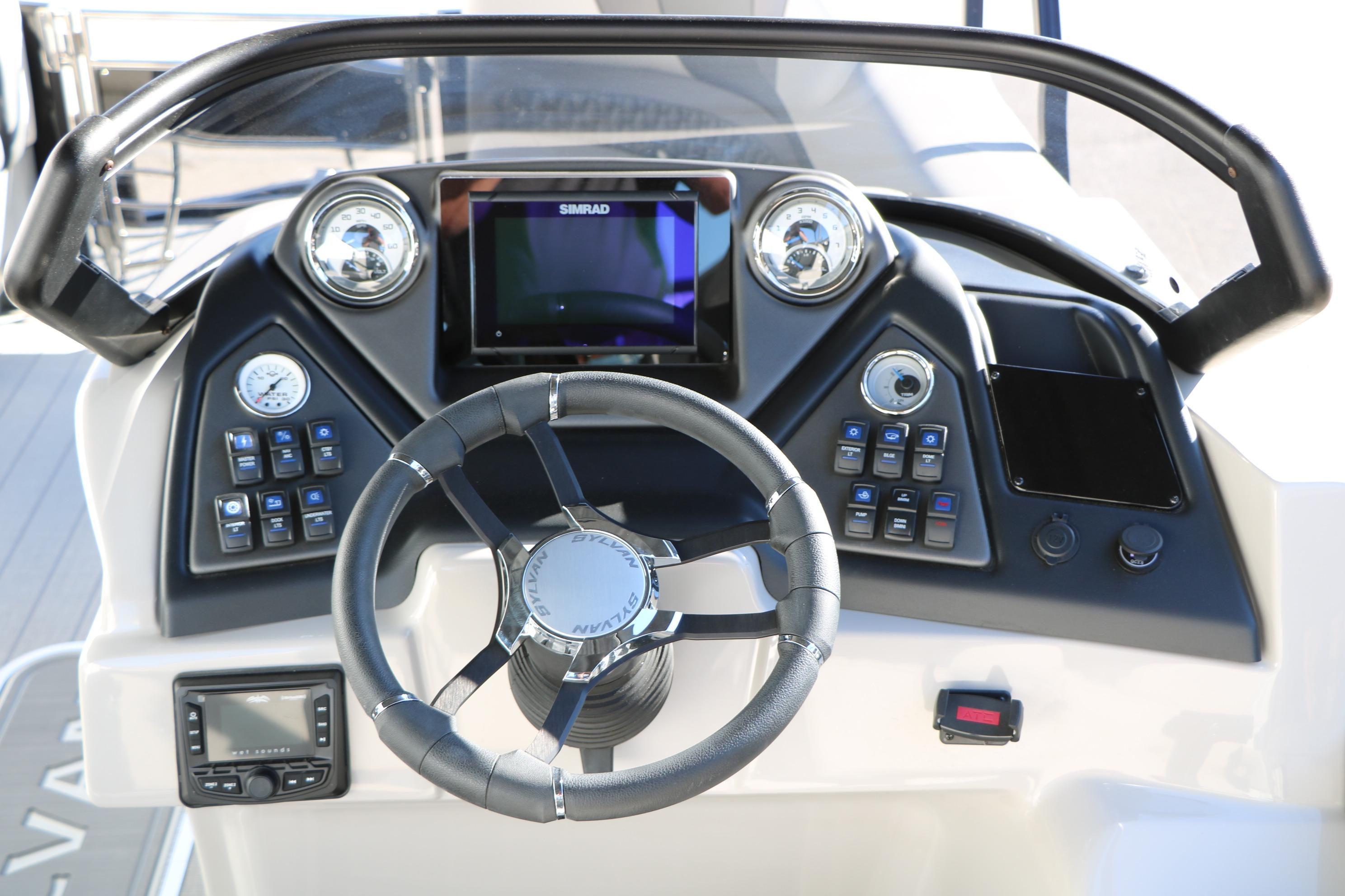 Steering console of 2026 Sylvan L3 CLZ DH boat with modern controls and display.