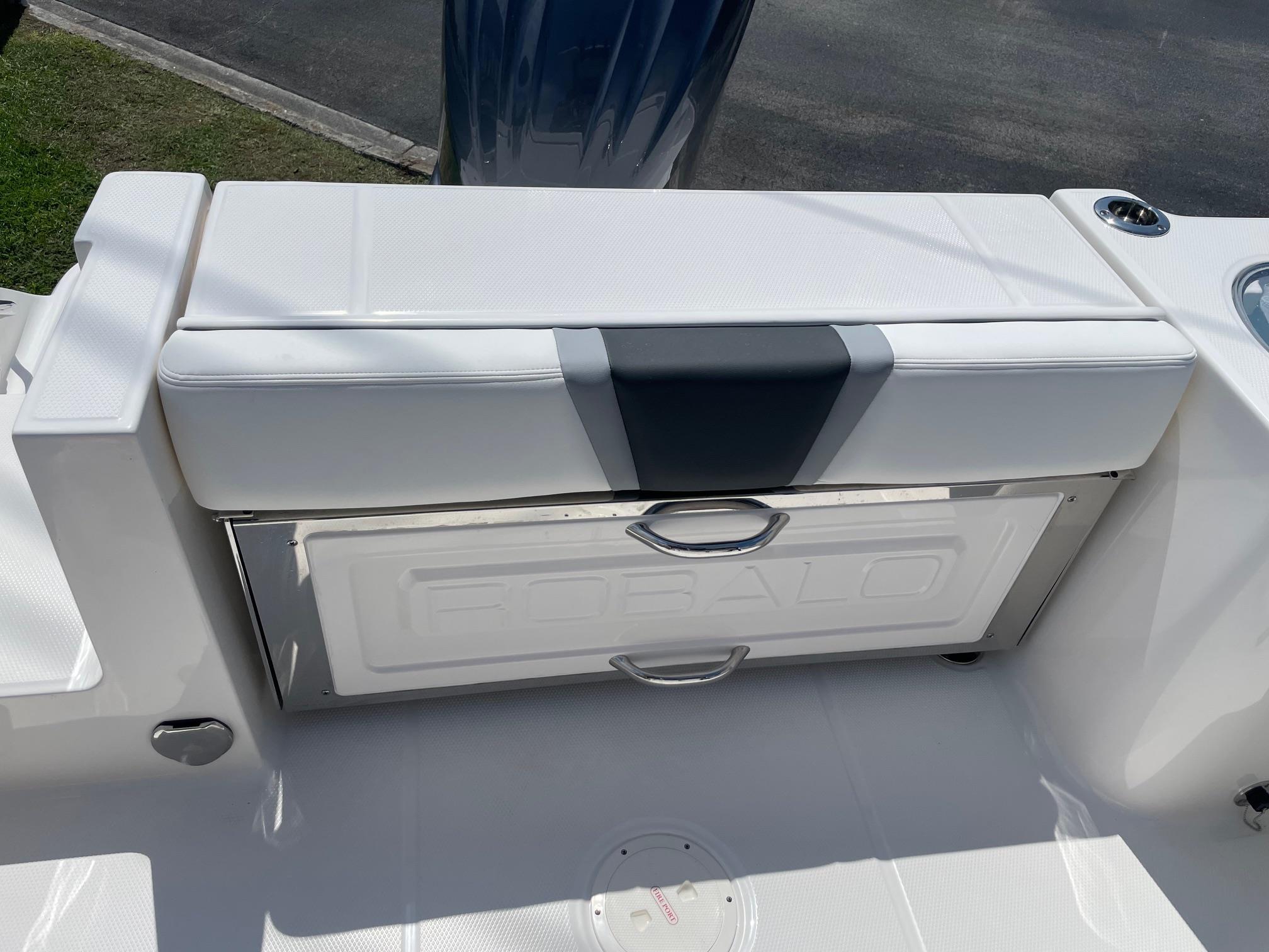 2025 Robalo R230 Center Console boat seat and storage compartment.