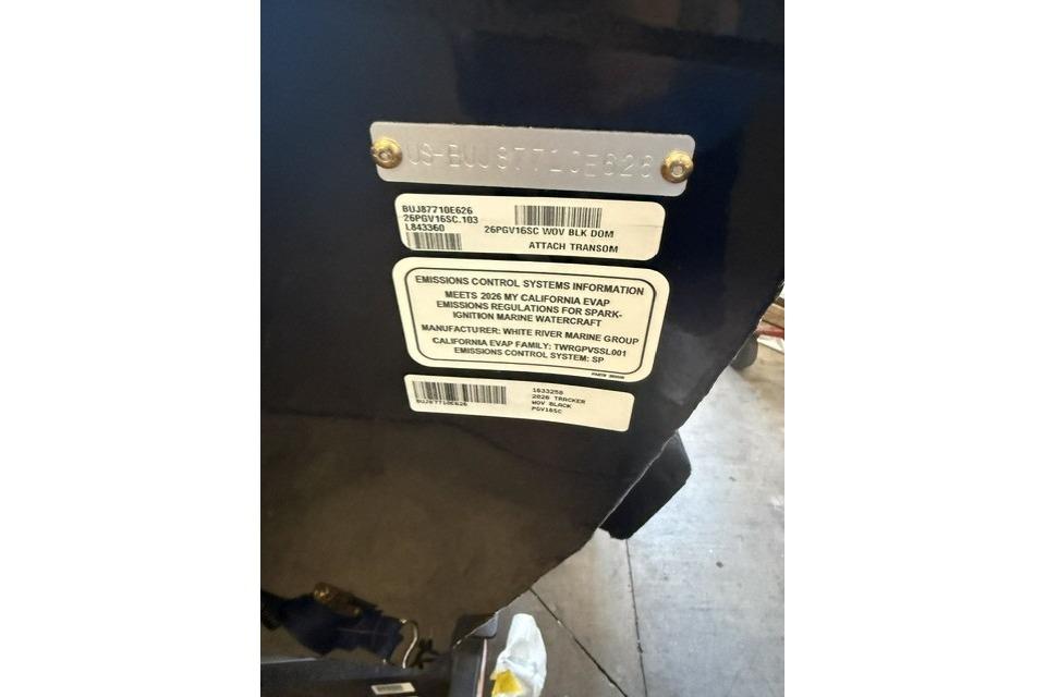 2026 Tracker Pro Guide V-16 SC emissions control label on transom.