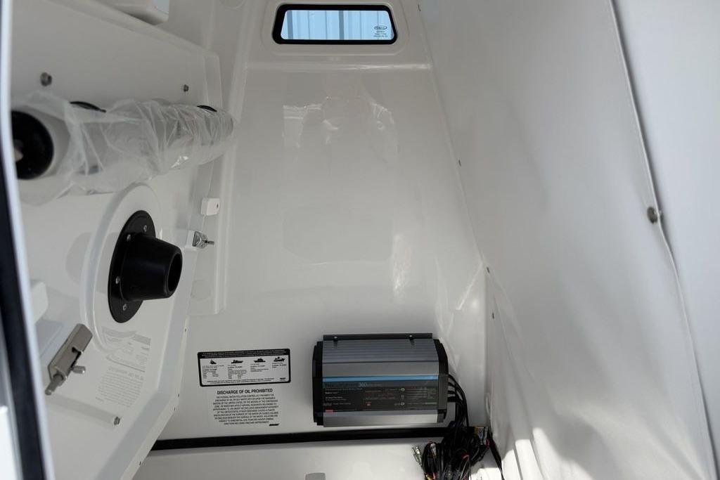 Interior of 2026 Sportsman Open 252 Center Console boat, featuring equipment and wiring.