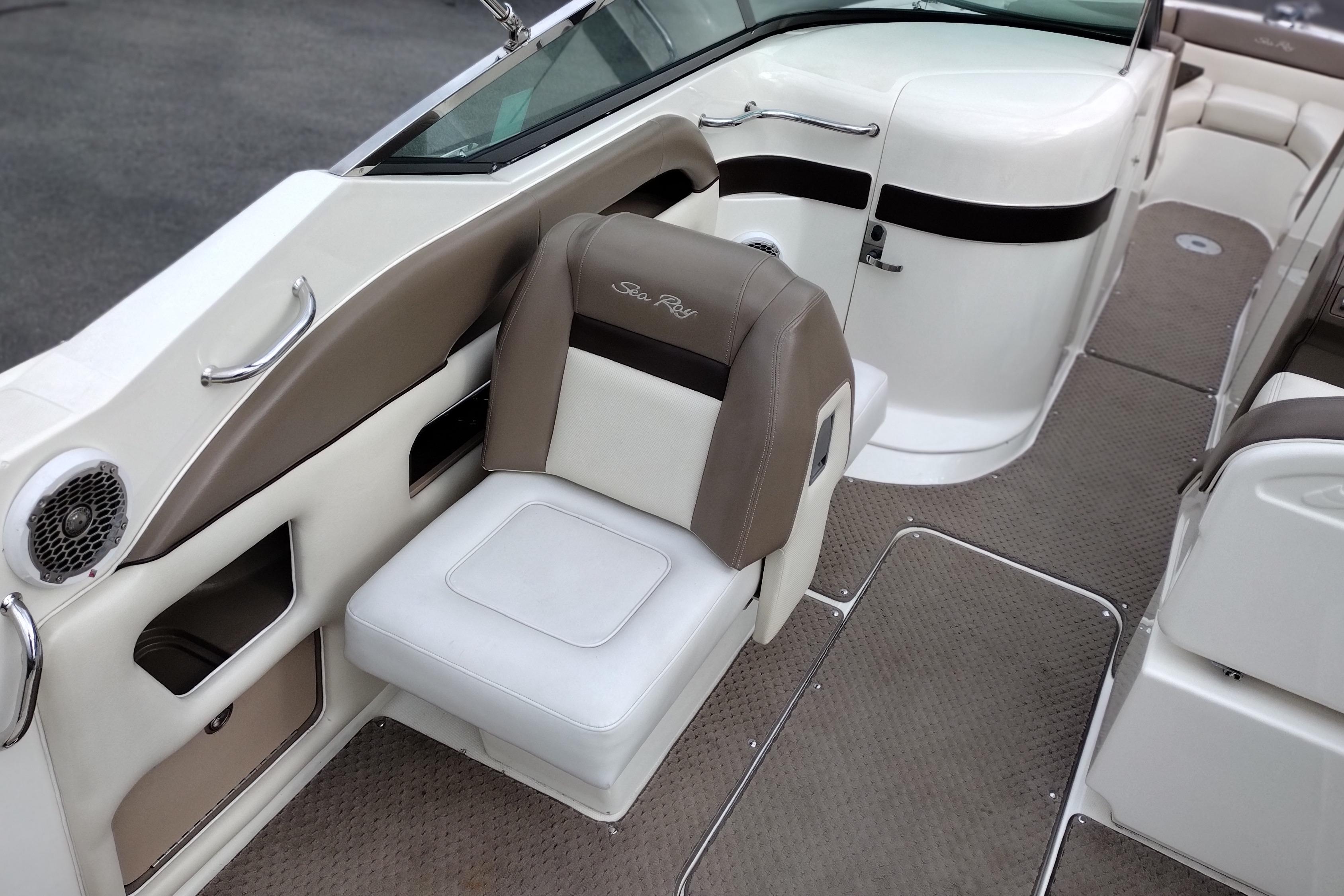 Interior of a 2013 Sea Ray 300 SLX boat, featuring beige and white seating.