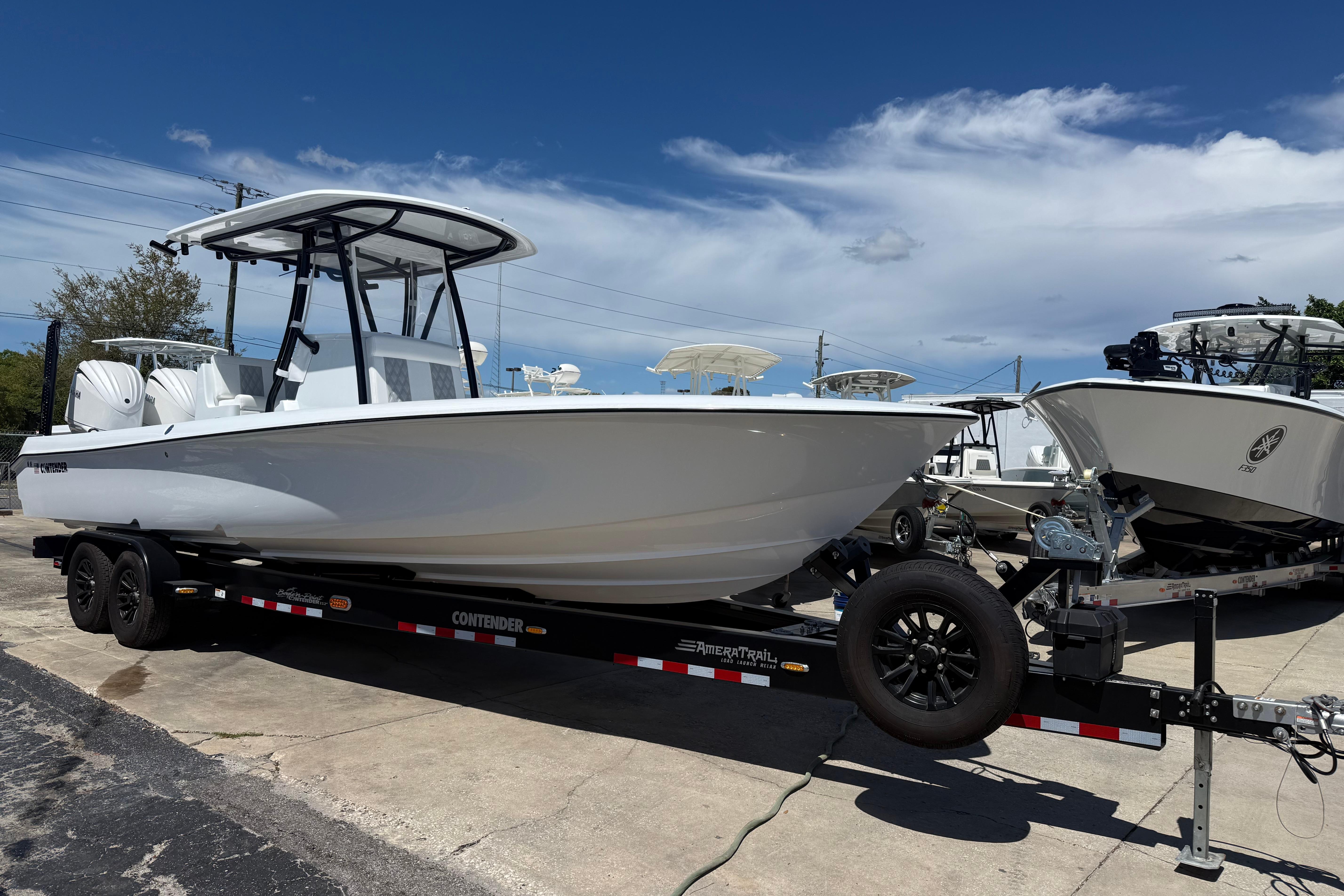 2026 Contender 29 Bay boat on trailer under clear blue sky.