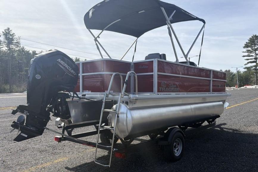2026 Sun Tracker Party Barge 18 DLX pontoon boat with Mercury outboard motor.